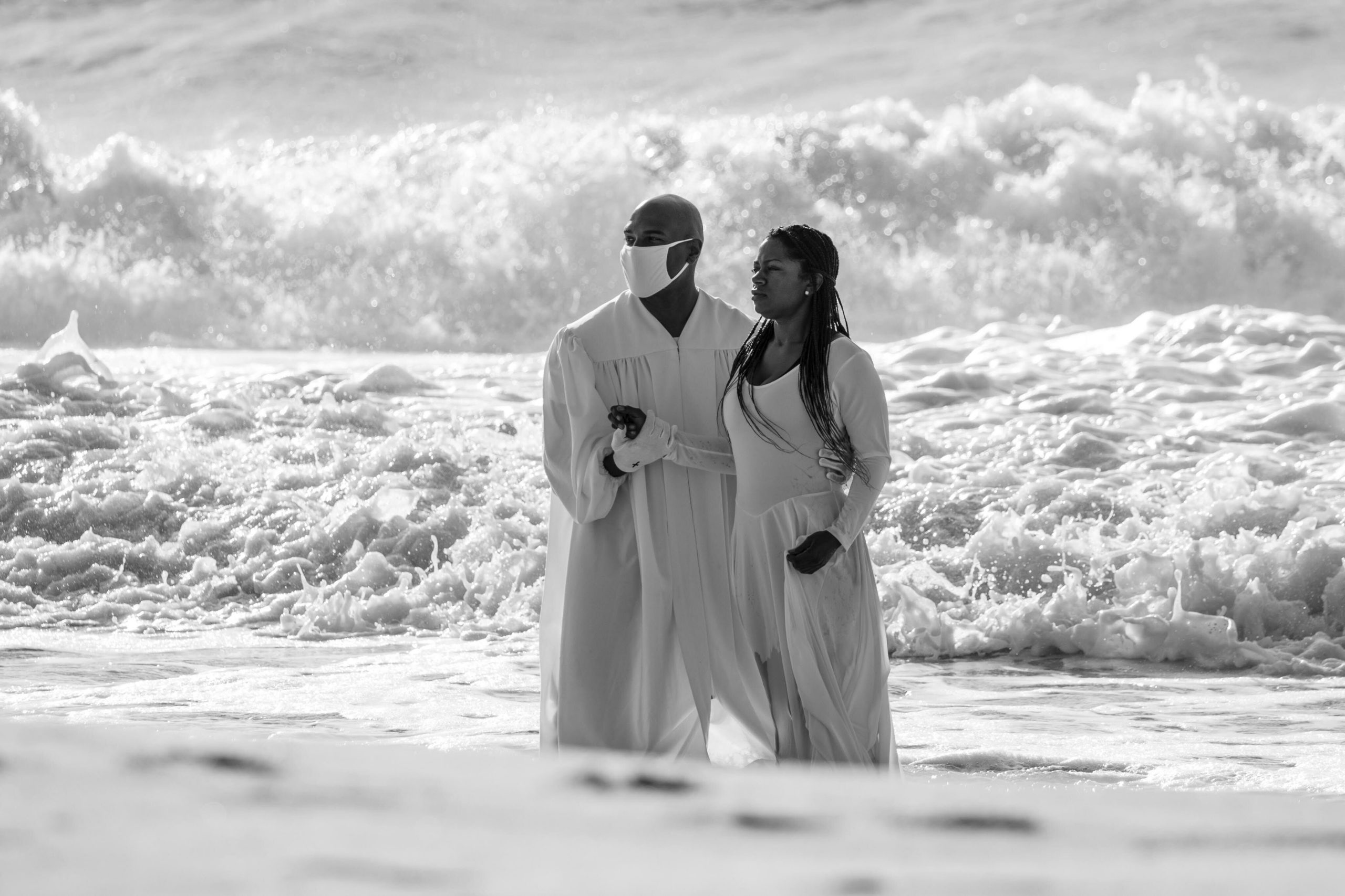 The Rev. Tisha Williams and her husband, Deacon Lawrence Williams, baptize Shakeva Brown and Delana Miller on Saturday in Bridgehampton. Both women have waited six months to be baptized as a result of the COVID-19 virus pandemic. 