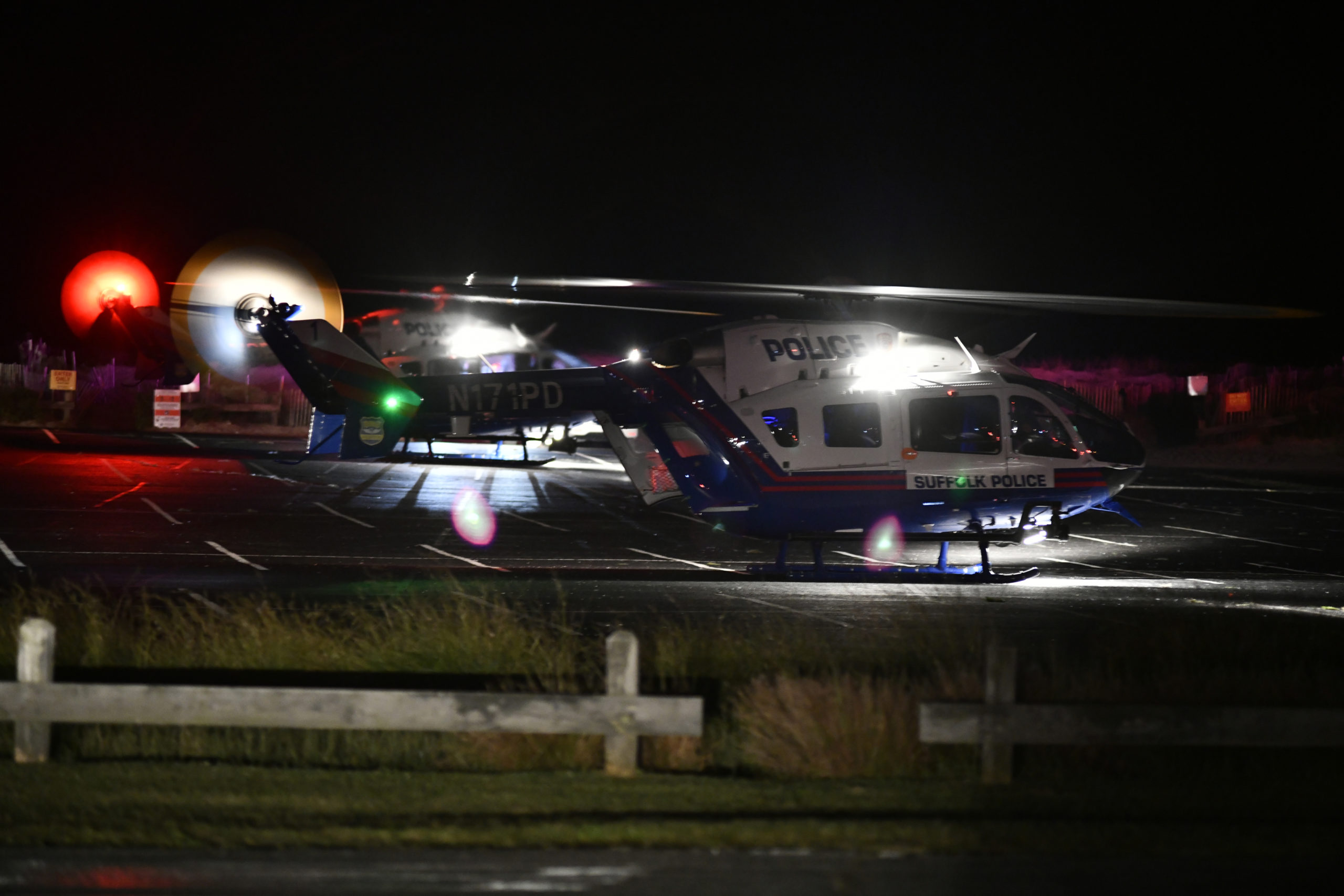 Two medevac helicopters landed at the Ponquogue Beach parking lot in Hampton Bays after an accident on Dune Road on Friday night. Both drivers were airlifted to Stony Brook University Hosptial.  DANA SHAW