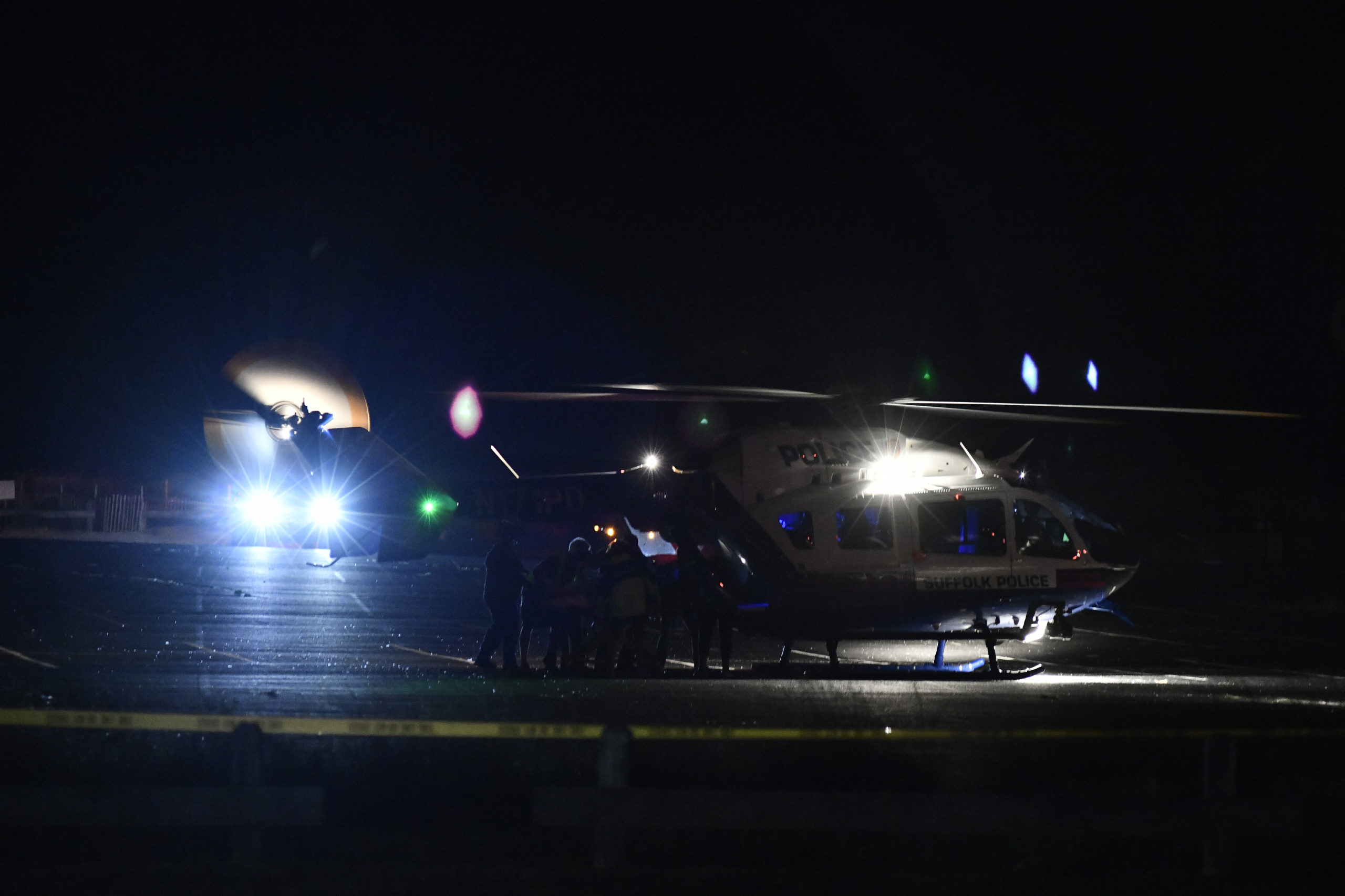 Two medevac helicopters landed at the Ponquogue Beach parking lot in Hampton Bays after an accident on Dune Road on Friday night. Both drivers were airlifted to Stony Brook University Hosptial.  DANA SHAW