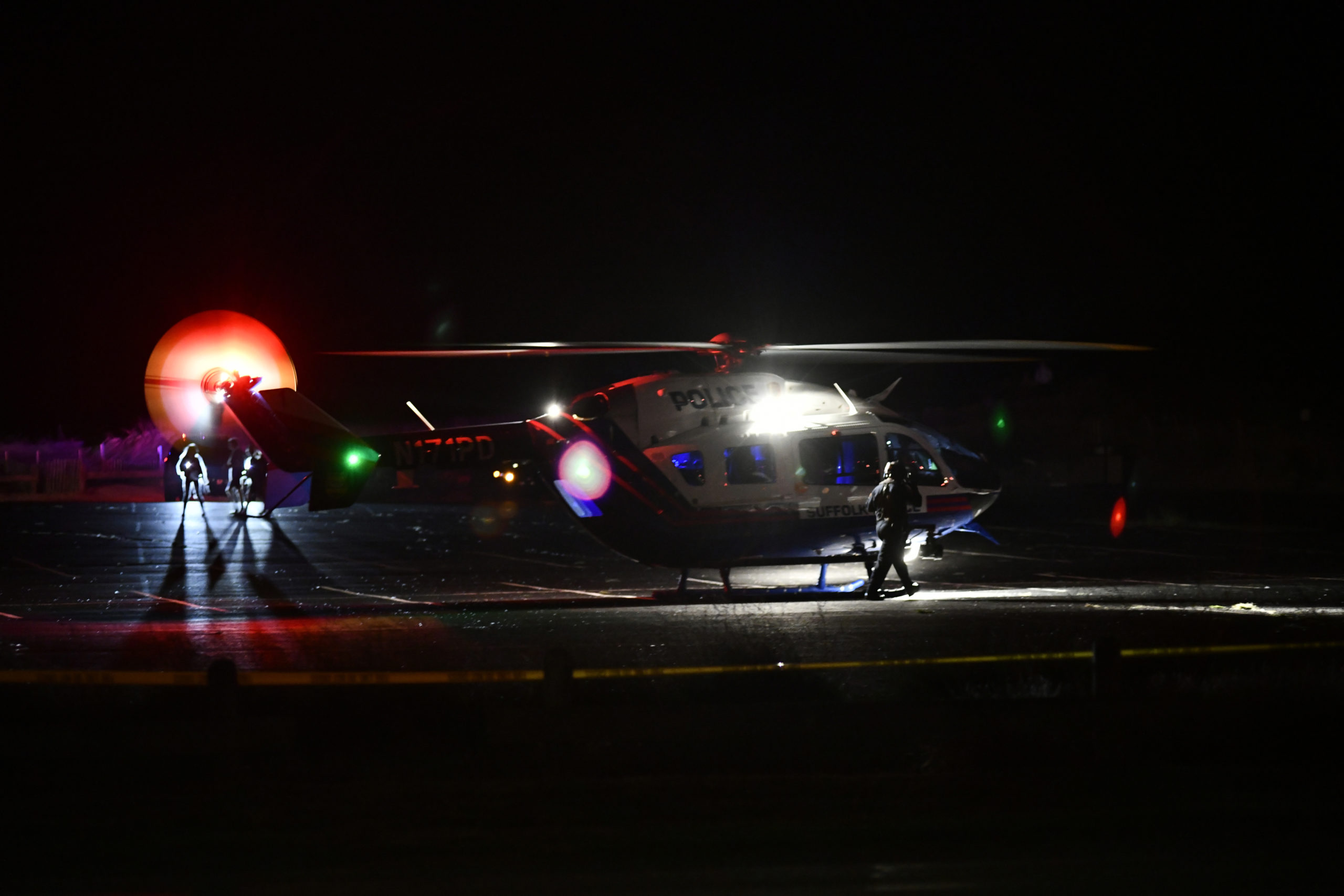 Two medevac helicopters landed at the Ponquogue Beach parking lot in Hampton Bays after an accident on Dune Road on Friday night. Both drivers were airlifted to Stony Brook University Hosptial.  DANA SHAW