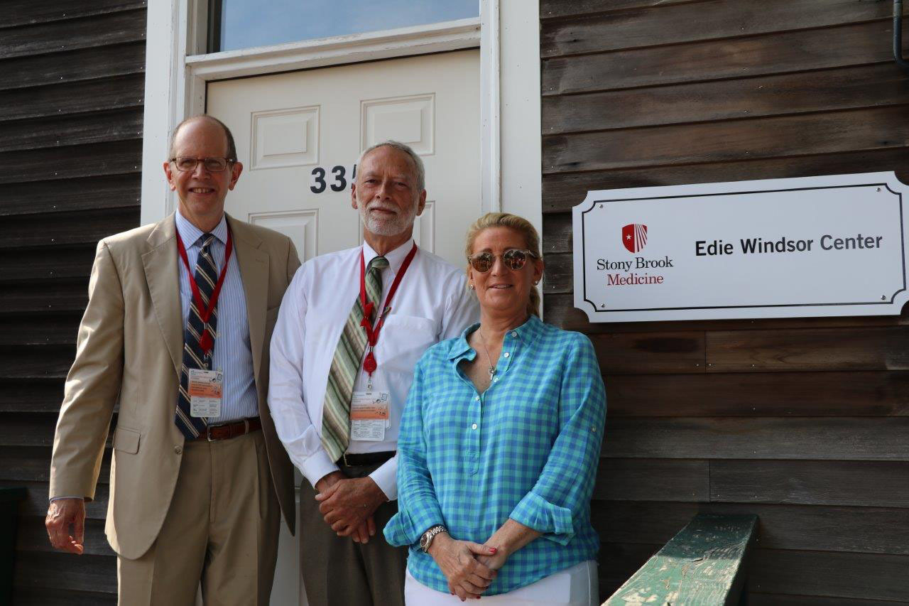 Robert S. Chaloner, Chief Administrative Officer, Stony Brook Southampton Hospital; Michael Collins, Site Administrator; and Judith Kasen-Windsor unveiled signage for the Edie Windsor Center at 335-B Meeting House Lane in Southampton, which was formally the David E. Rogers, MD Center. The name change reflects plans for the Edie Windsor Center to serve as a dynamic conduit to an expanding array of initiatives as part of the Hospital's vision of reimagining the healthcare landscape on the East End.     COURTESY STONY BROOK SOUTHAMPTON HOSPITAL
