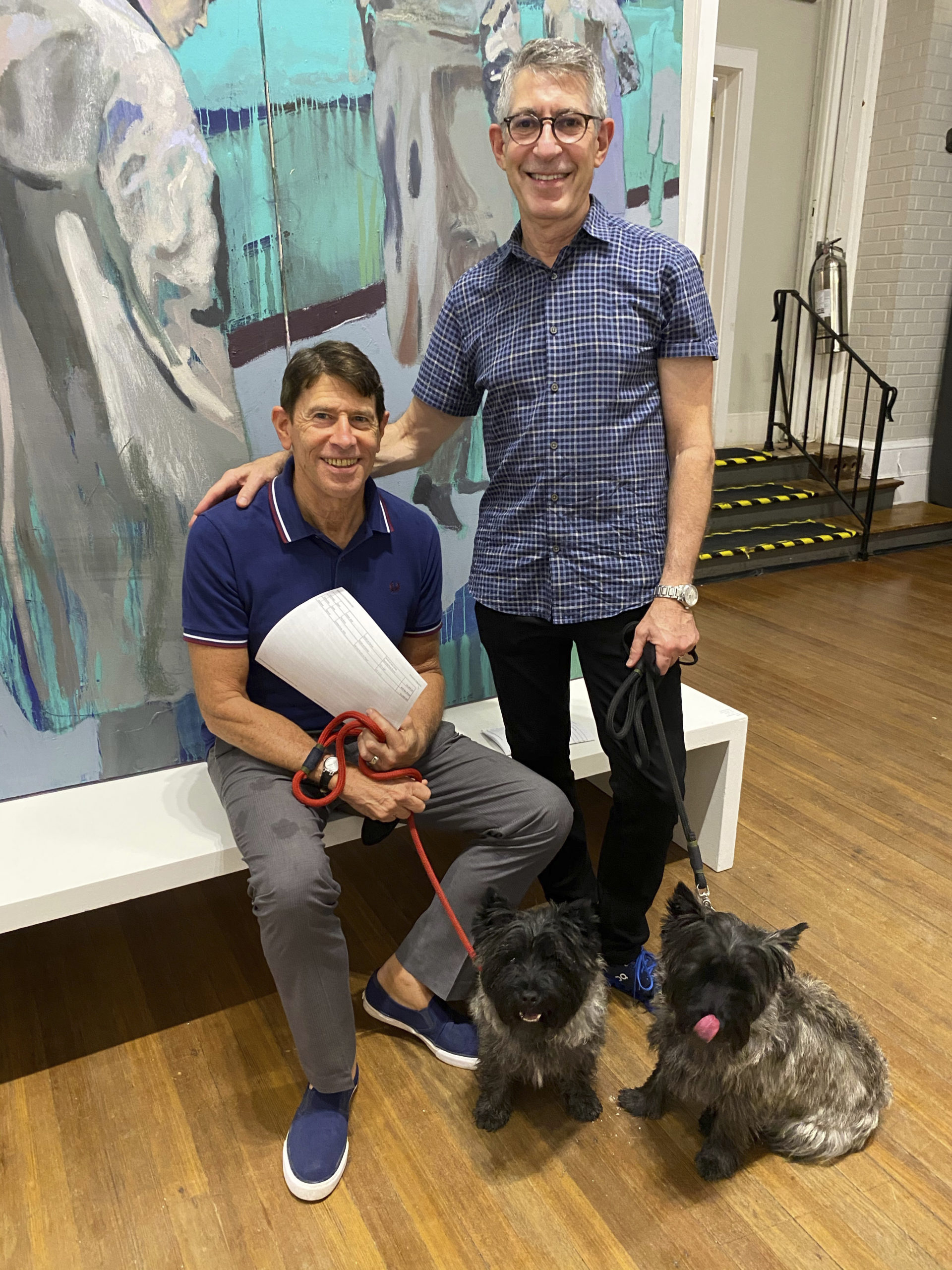 Paul Travis and Mark Fichandler with their Cairn Terriers Charlie and Jack.