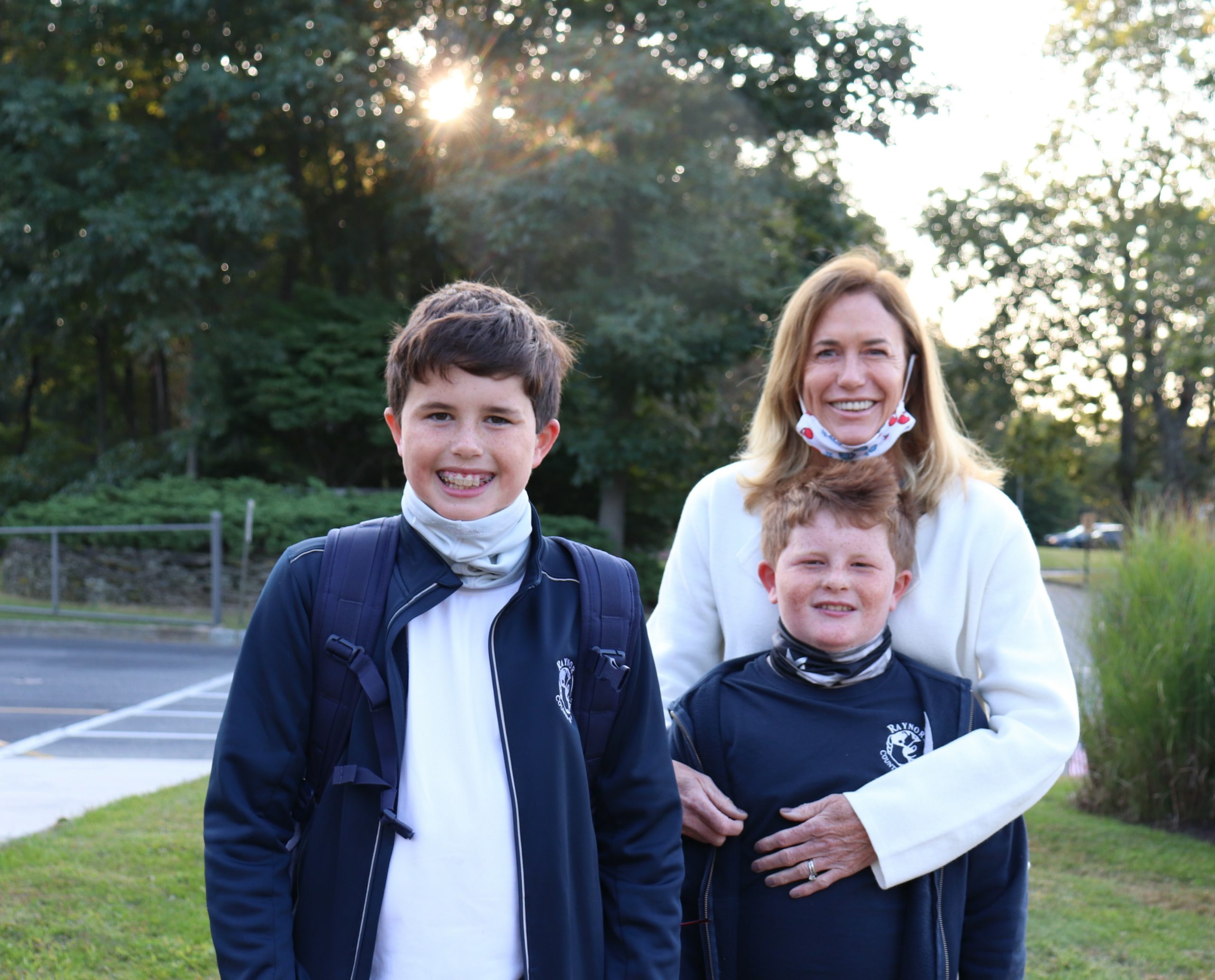 Raynor Country Day School parent, Michelle Kelly poses with her boys, fellow RCDS students, Sean and Kevin Kelly, before the school's 