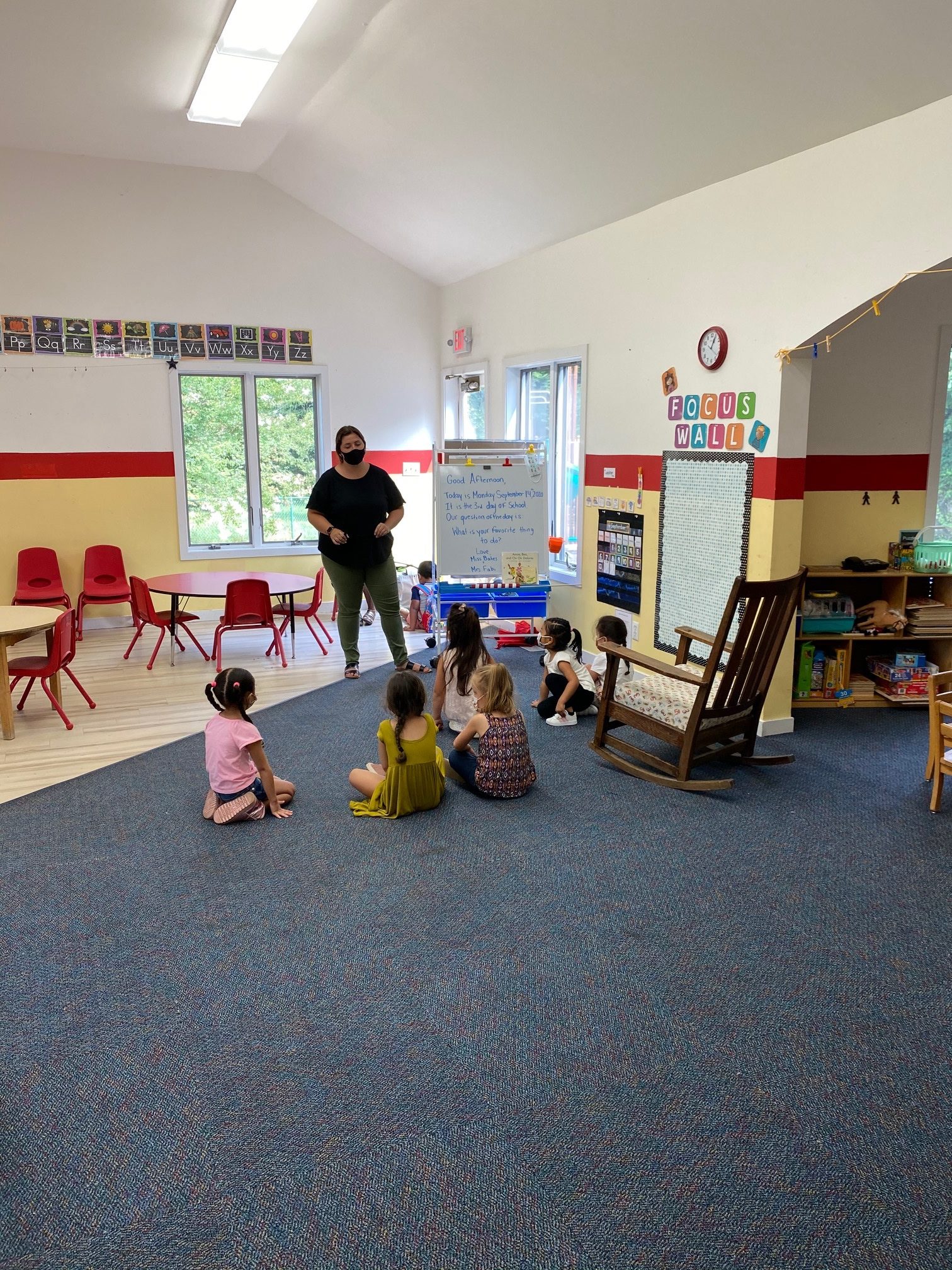 Teachers work with pre-kindergarten students at the Eleanor Whitmore Early Childhood Center.