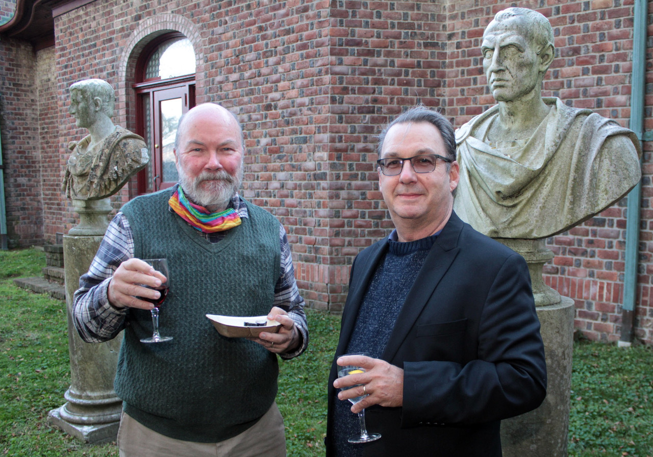 Sag Harbor's Ken Dorph and Steve Shaughnessy enjoying cocktails and hors d'oeuvres on the SAC lawn.