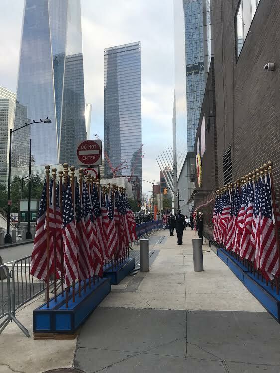 Flags border the wall alongside the firehouse across from Ground Zero.  COURTESY JAMES BURKE
