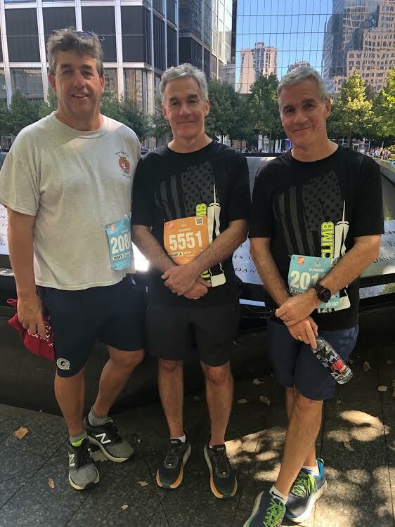 Southampton Town Attorney James Burke, with brothers Christopher and Michael at last year's Tunnel to Tower Climb. COURTESY JAMES BURKE