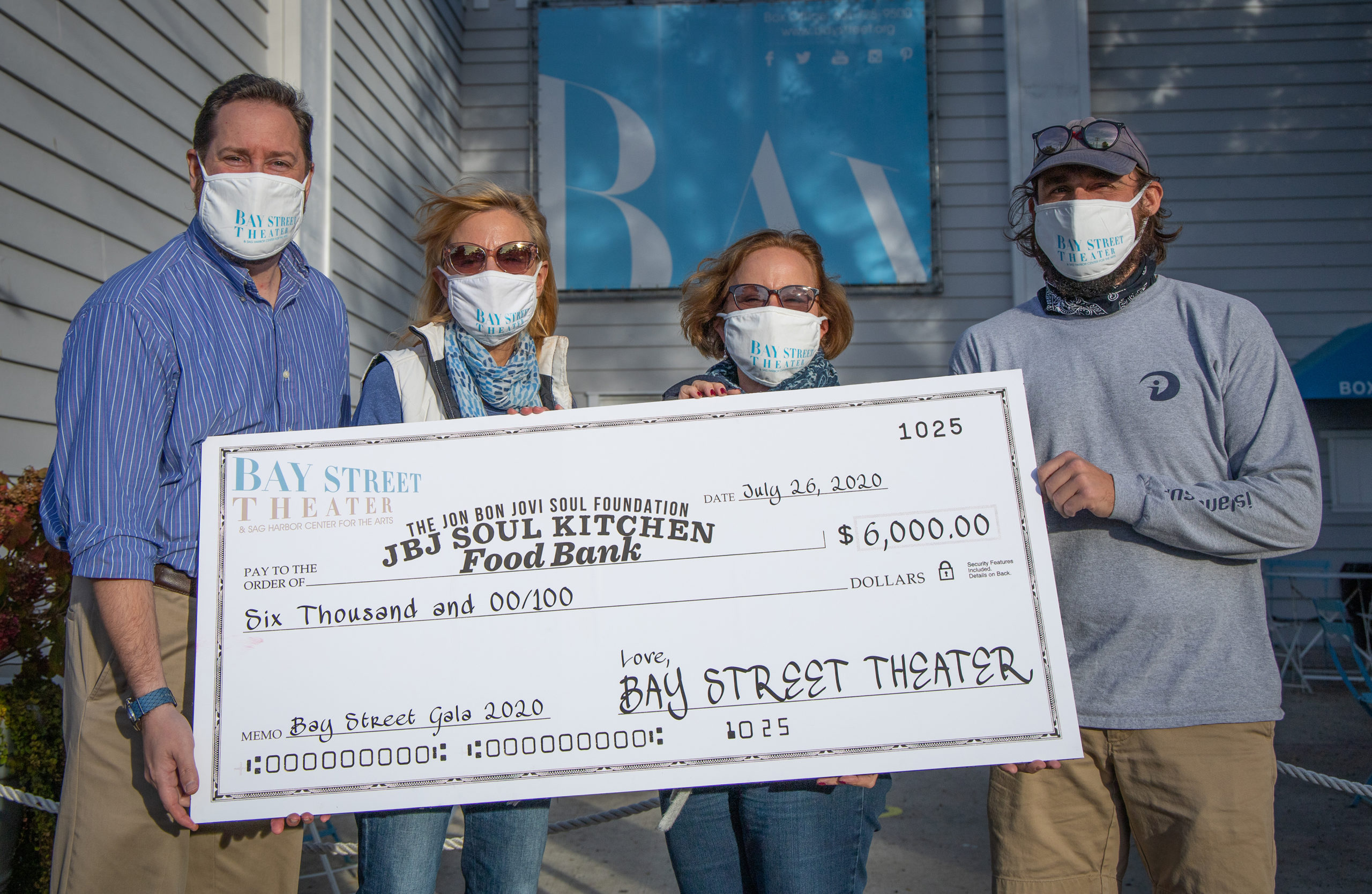 Bay Street Theater Box Office Manager David Kolodny, Executive Director Tracy Mitchell, Director of Development Kim Fink and Marketing Coordinator Michael Pintauro with a check for JBJ Soul Kitchen Food Bank. 