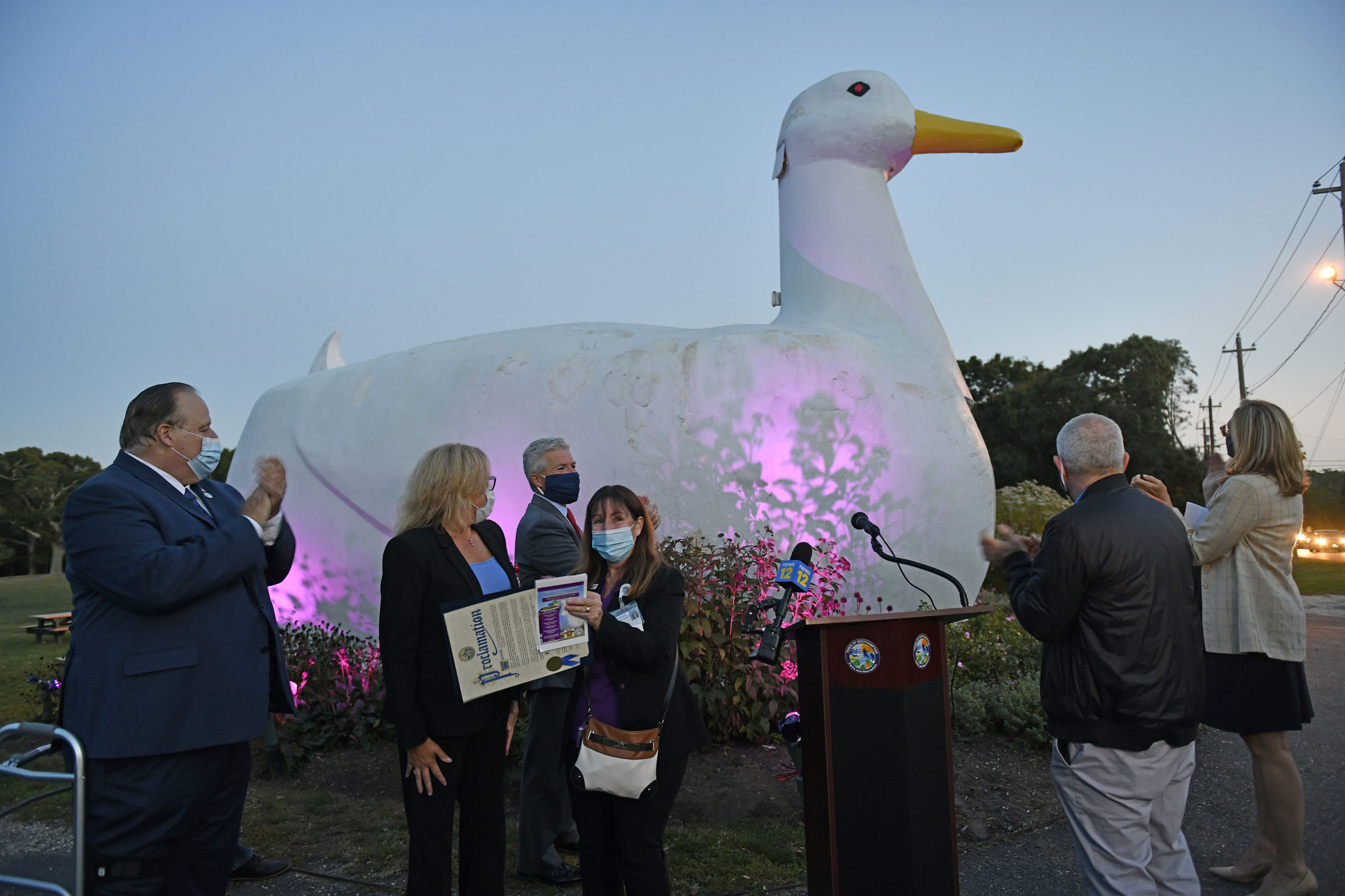 In honor of Emergency Nurses Week, The Town of Southampton lighted the Big Duck in Flanders purple on October 14. Southampton Town Supervisor Jay Schneiderman presented a proclamation and was joined by town board members, Couty Executive Steve Bellone, Assemblyman Fred W. Thiele Jr., and County Legislator Bridget Fleming.    DANA SHAW