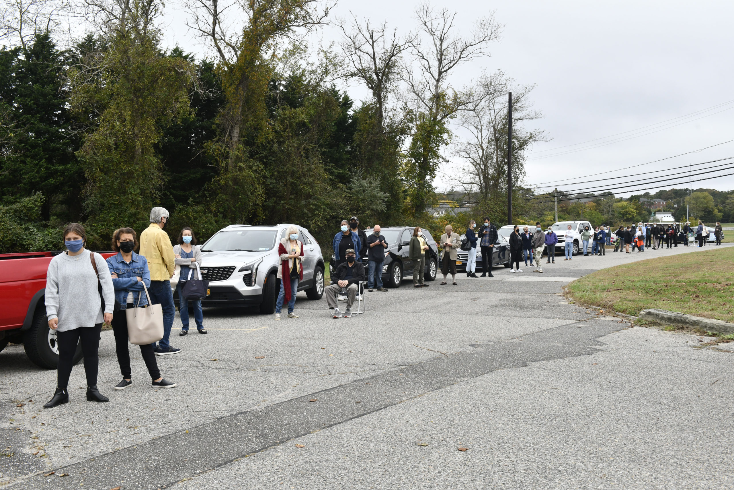 A line from the Stony Brook Southampton gym snaked on to Tuckahoe Road as early voting opened in Southamtpon Town on Saturday morning.  DANA SHAW