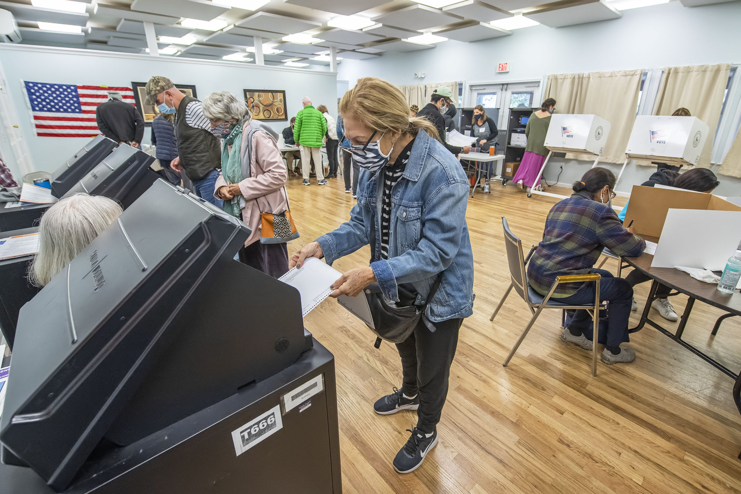 Voters cast their ballots as part of Early Voting in East Hampton Town at the Windmill Village complex on Accabonac Road on Monday morning.   MICHAEL HELLER