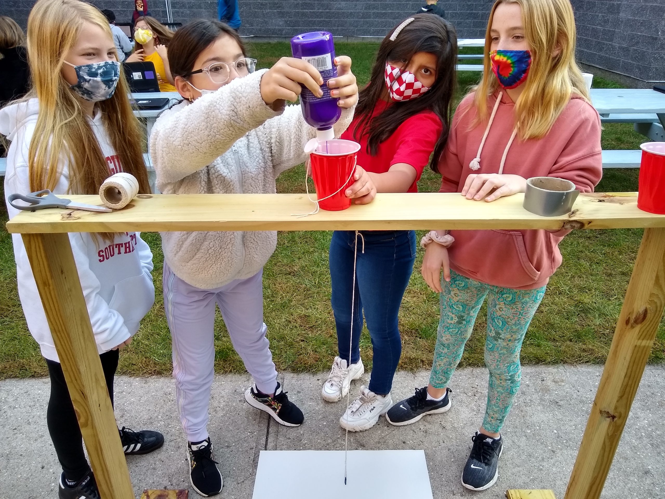 Hampton Bays Middle School students designed pendulum painting apparatuses as part of a lesson on the science behind pendulums. 