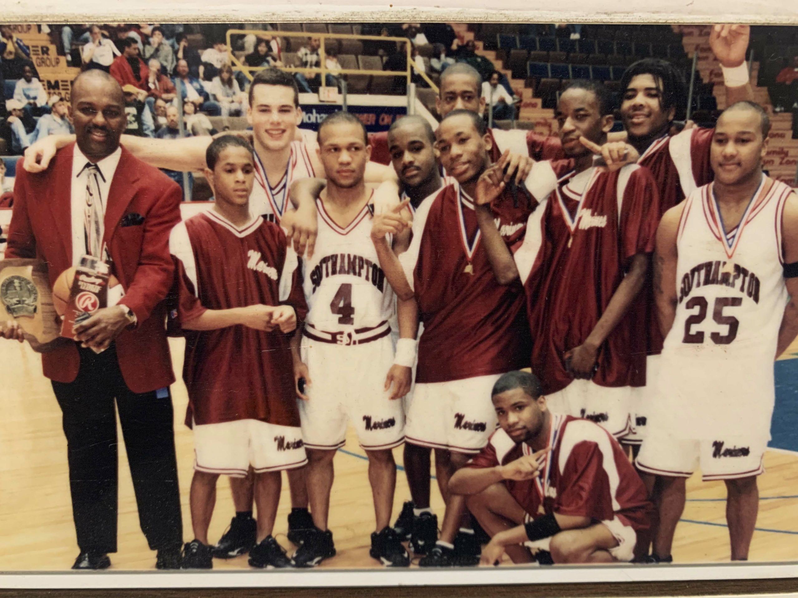 Courtney Pritchard, fifth from left, with his Southampton teammates and head coach Herm Lamison (far left) after winning the New York State Class B Championship in 2000.