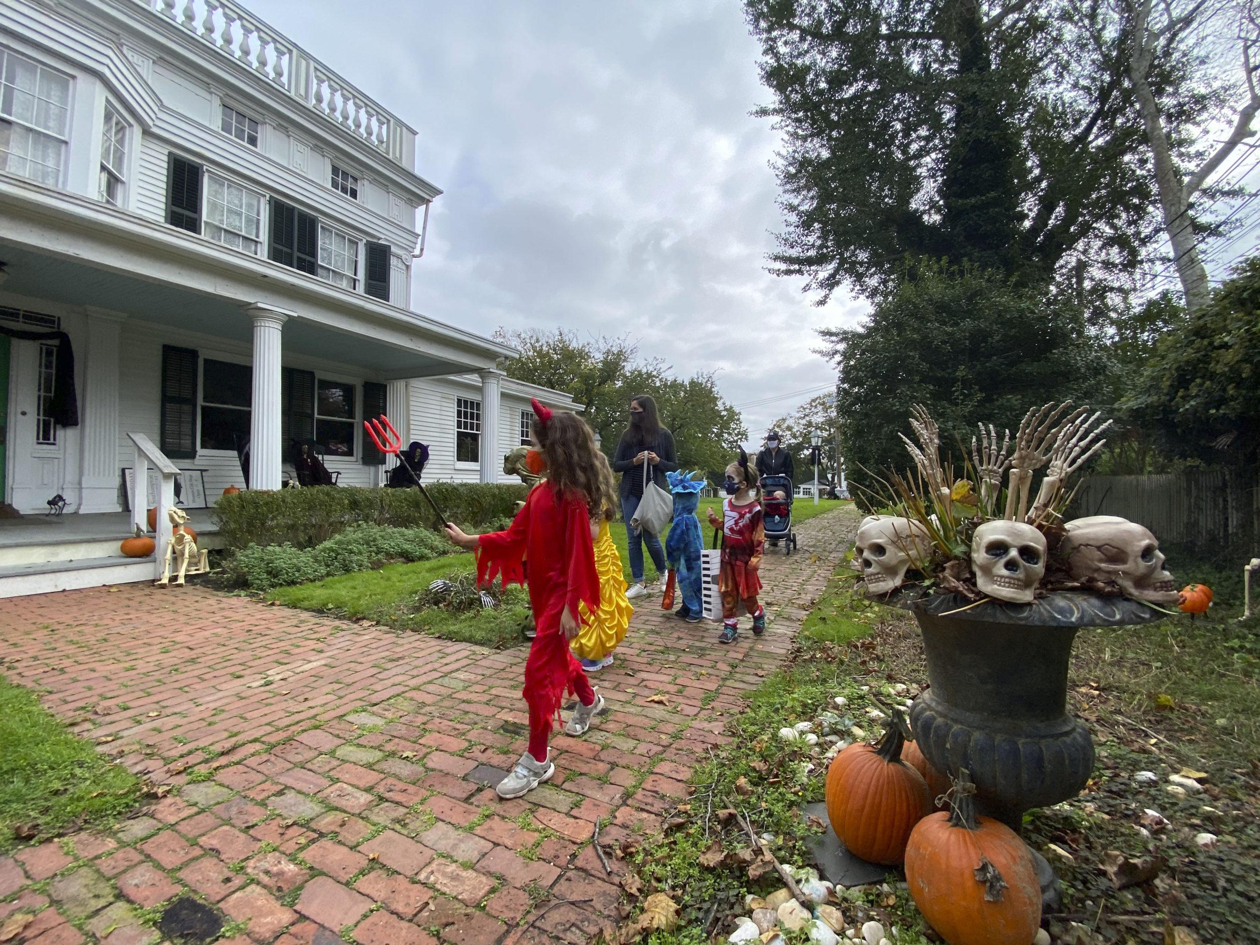 Children visit the Haunted Village at the Southampton History Museum on Saturday. The grounds of the Rogers Mansion are decorated for Halloween and are inhabited by witches, ghouls and even a plague doctor. The Haunted Village will be opened on Saturday October 31 from 2 to 4 p.m. Visitors are encouraged to wear their costumes. Reservations required with timed entrances for a 20 minute tour. Limited to 100 people at one time, only family groups of up to 6 allowed per reservation. Children must be accompanied by an adult with a reservation. Facemasks required and social distancing strictly enforced. Call (631) 283-2494 or visit southamptonhistory.org for more information. DANA SHAW