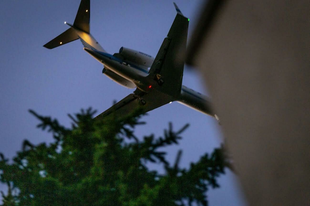 Just above the treetops, a massive jet makes for Gabreski Airport. COURTESY MICHAEL DONNELLY