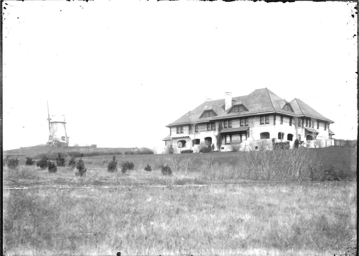 The windmill, alongside the mansion owned by Arthur Brigham Claflin, a prominent textile magnate, as it appeared circa 1900. COURTESY SOUTHAMPTON HISTORY MUSEUM 