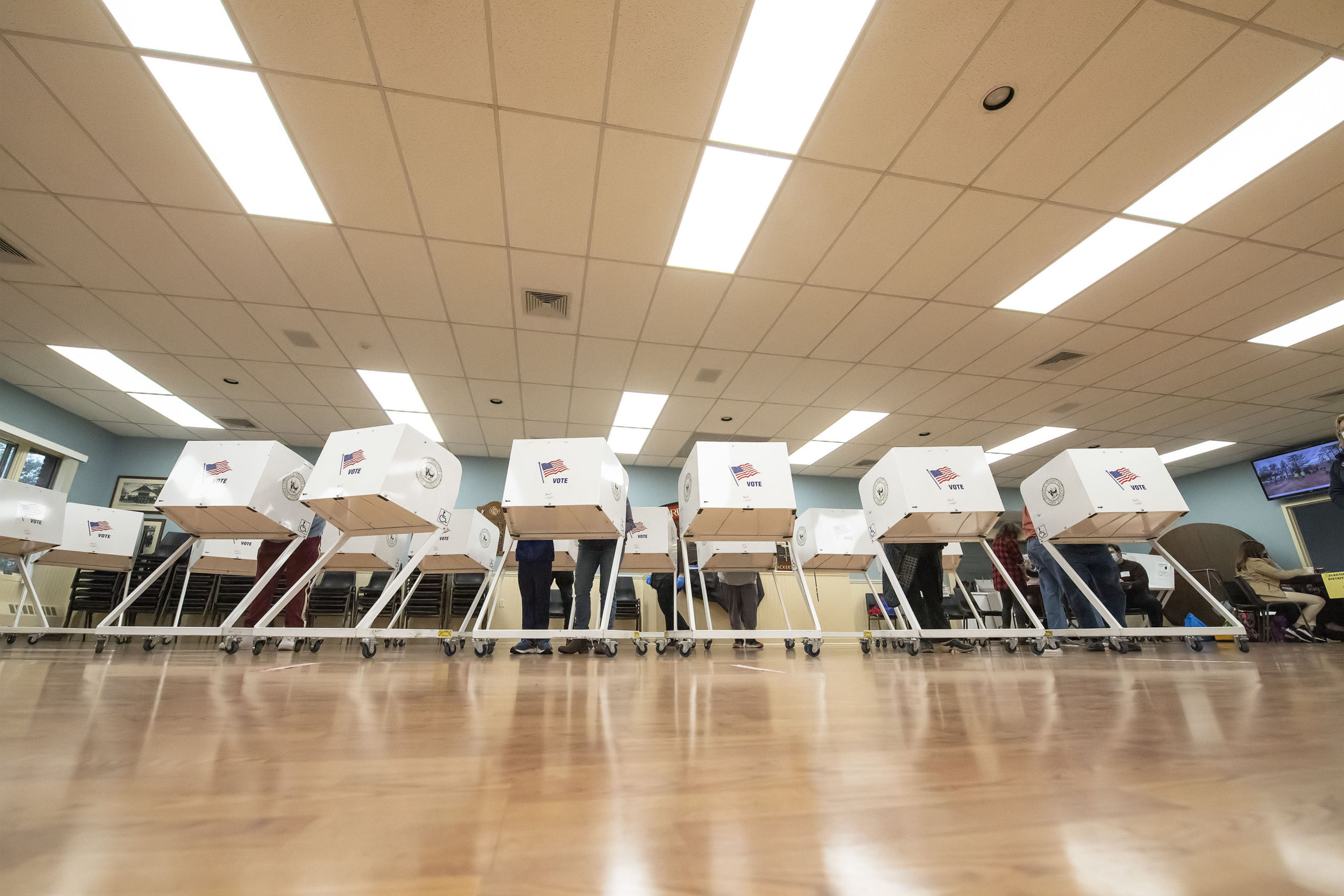 Voters at the polling station at the Springs firehouse on Election Day morning.    MICHAEL HELLER