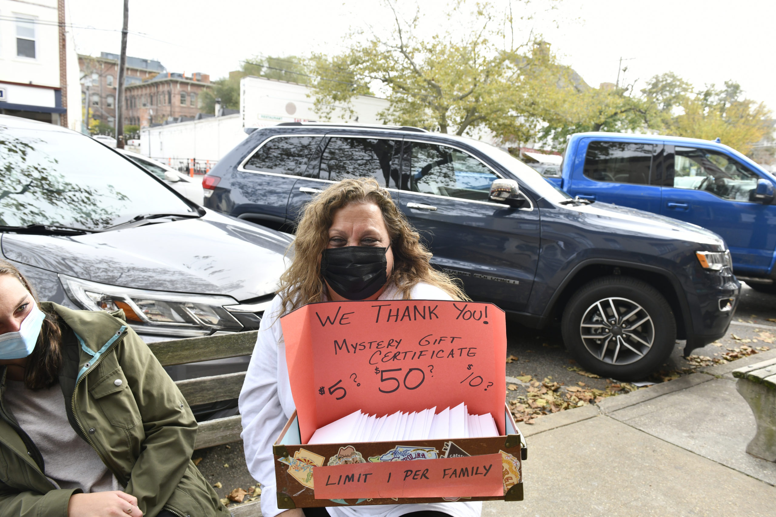 Lisa Field presents customers with Mystery Gift Certificates on Saturday at the Sag Harbor Variety Store's 50th anniversary celebration.    DANA SHAW