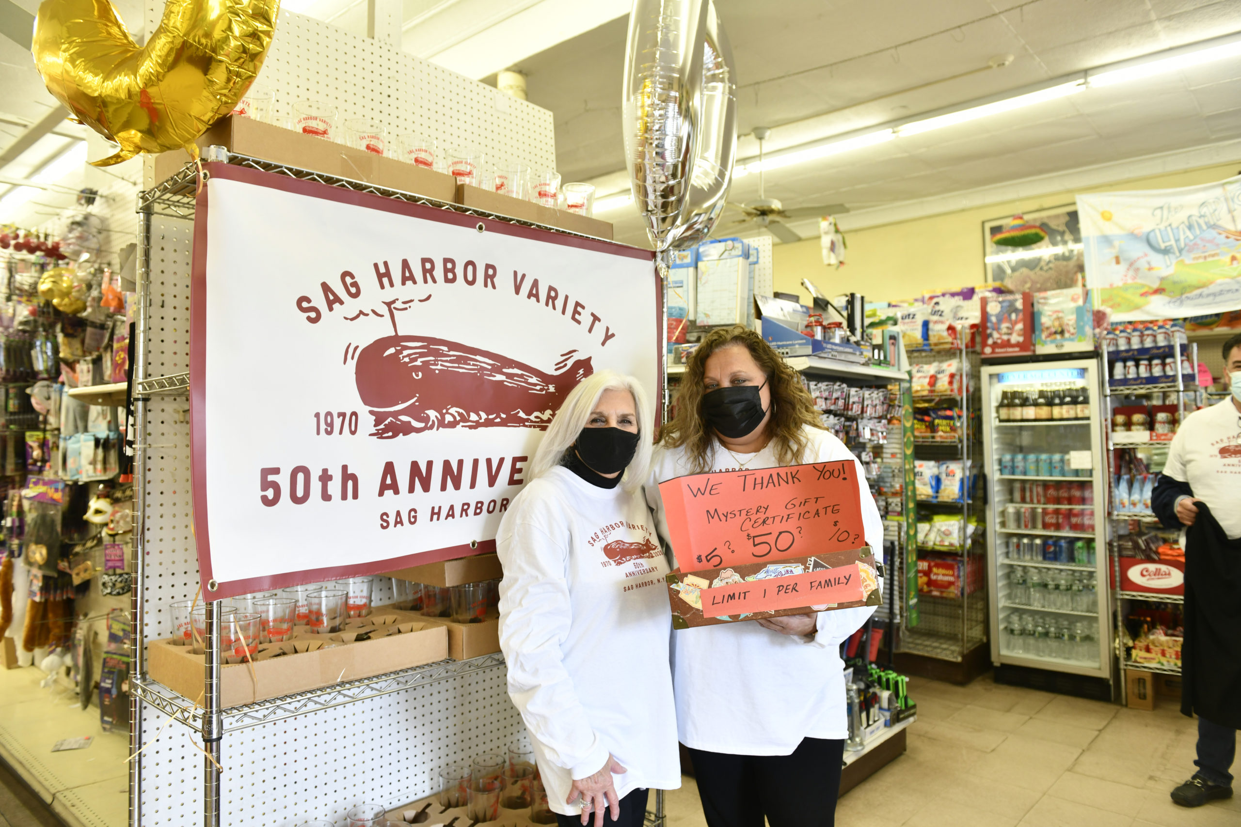 Roseann Bucking and Lisa Field greet customers on Saturday at the Sag Harbor Variety Store's 50th anniversary celebration.    DANA SHAW