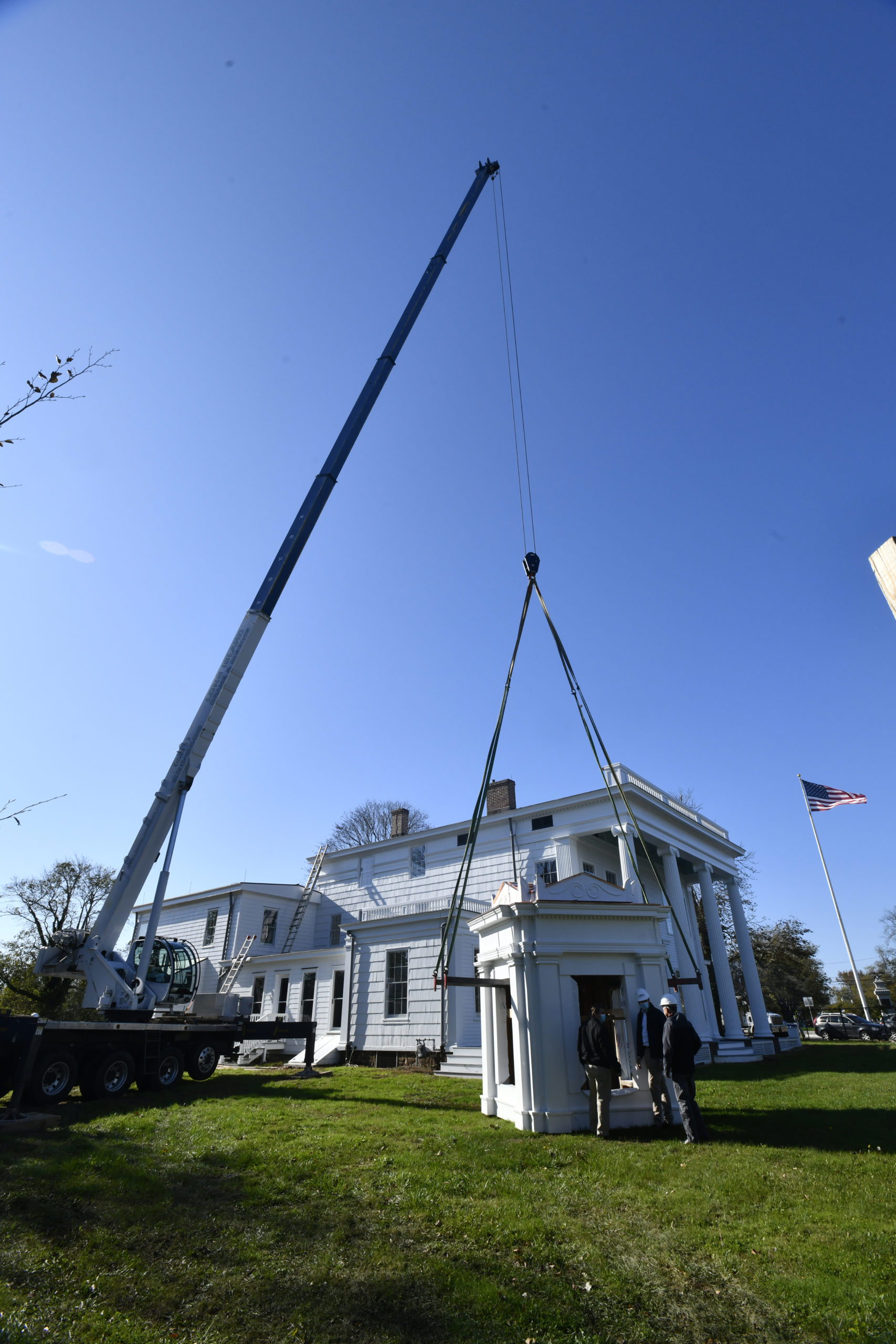 The decorative cupola was placed back on the rooftopof the National Rogers House in Bridgehampton.   DANA SHAW