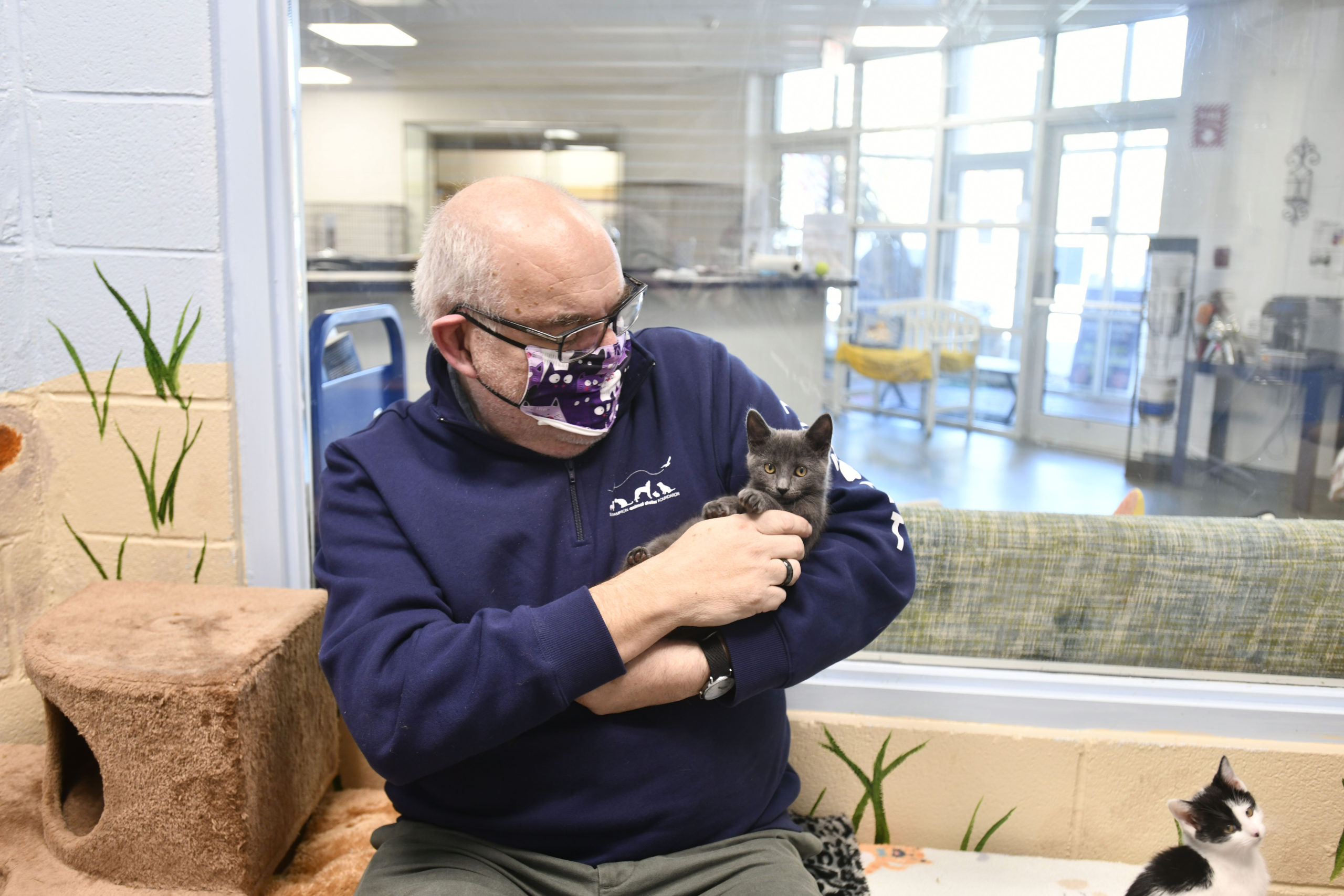 Joe Sprague with one of his charges at the Southampton Animal Shelter.  DANA SHAW