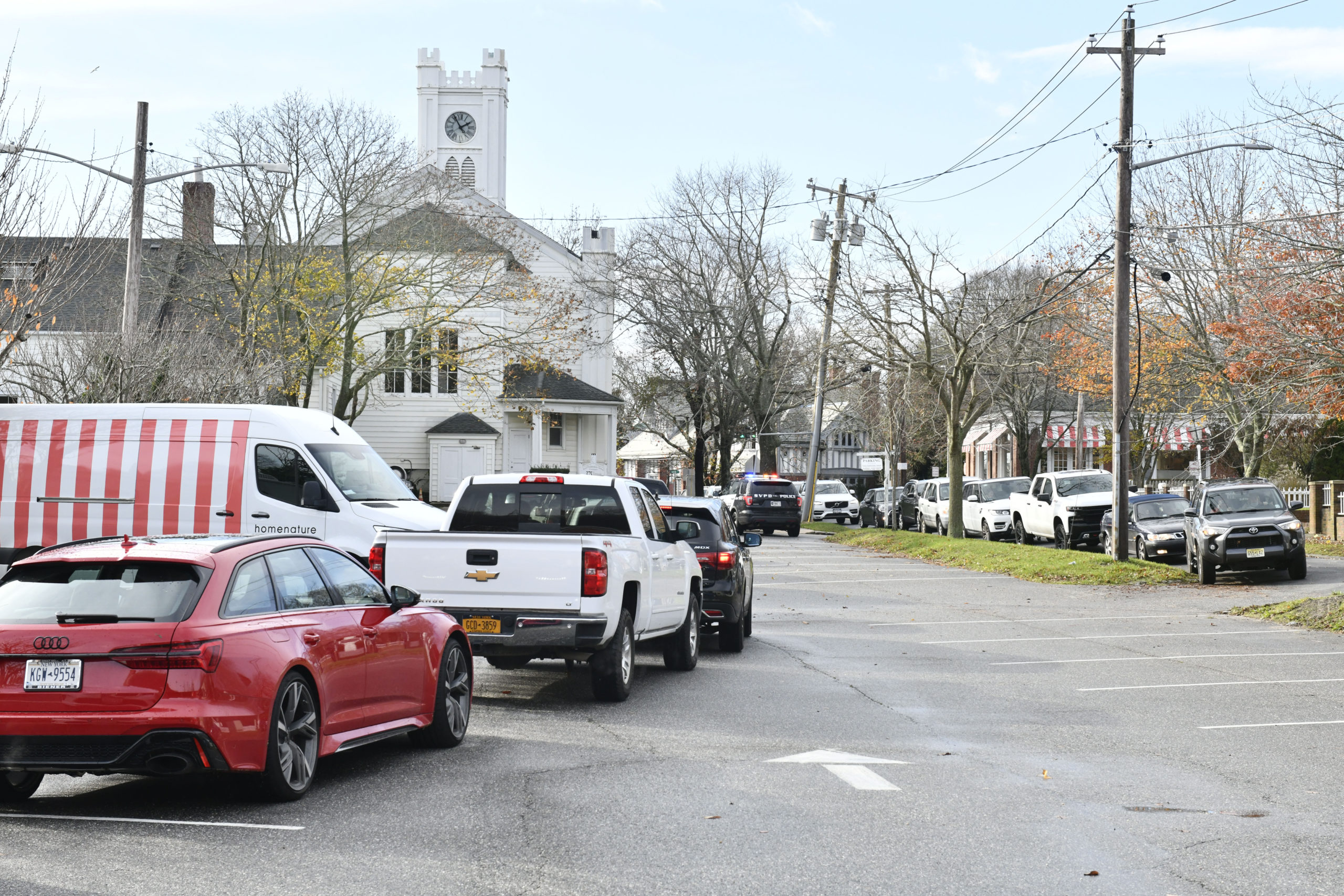 Cars line up for mobile COVID testing in the parking lot of the First Presbyterian Church in Southampton Village on Monday.      DANA SHAW