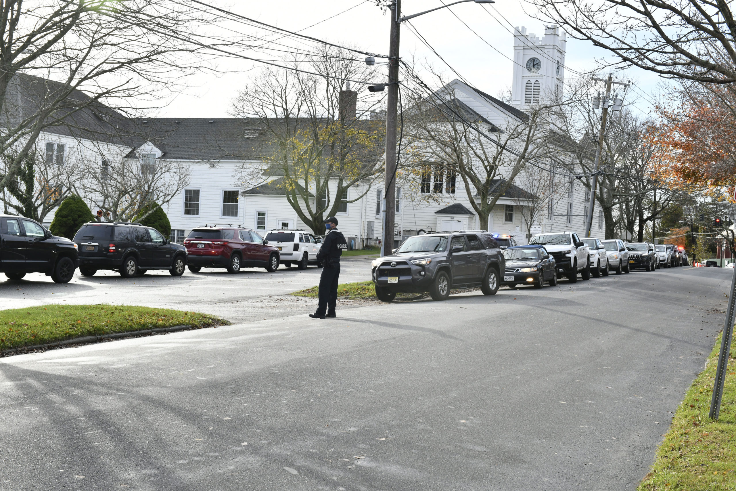 Cars line up for mobile COVID testing in the parking lot of the First Presbyterian Church in Southampton Village on Monday.      DANA SHAW