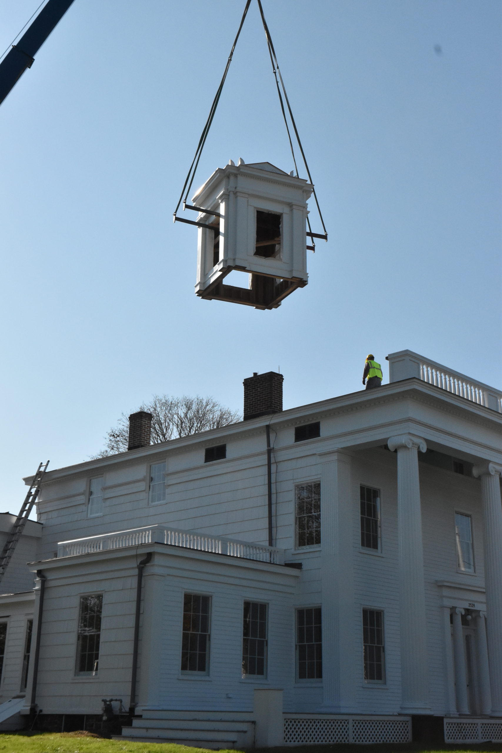 The cupola is lifted to the roof of the Nathaniel Rogers House in Bridgehampton on November 4. STEPHEN J. KOTZ