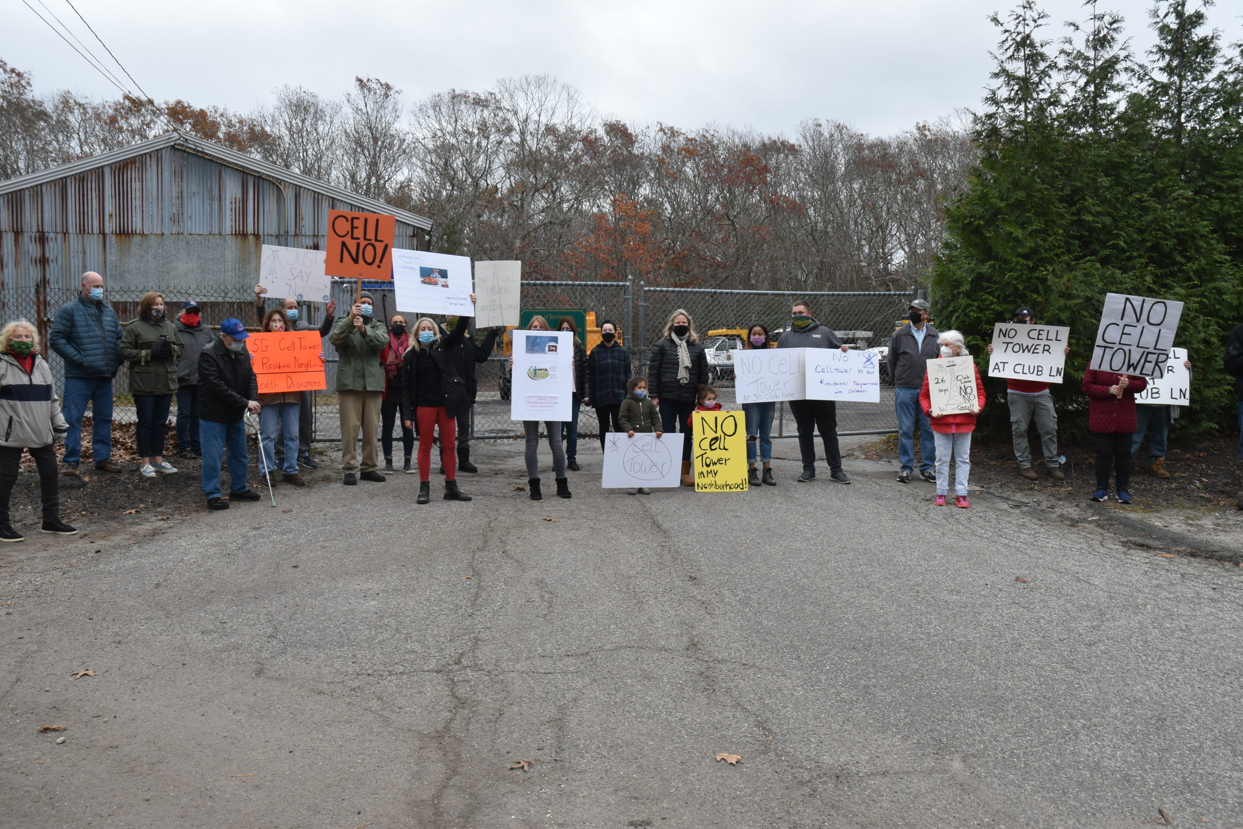 Noyac residents gathered Sunday to protest a proposal to build a cell tower at the Southampton Town Highway Department property at 30 Club Lane. STEPHEN J. KOTZ
