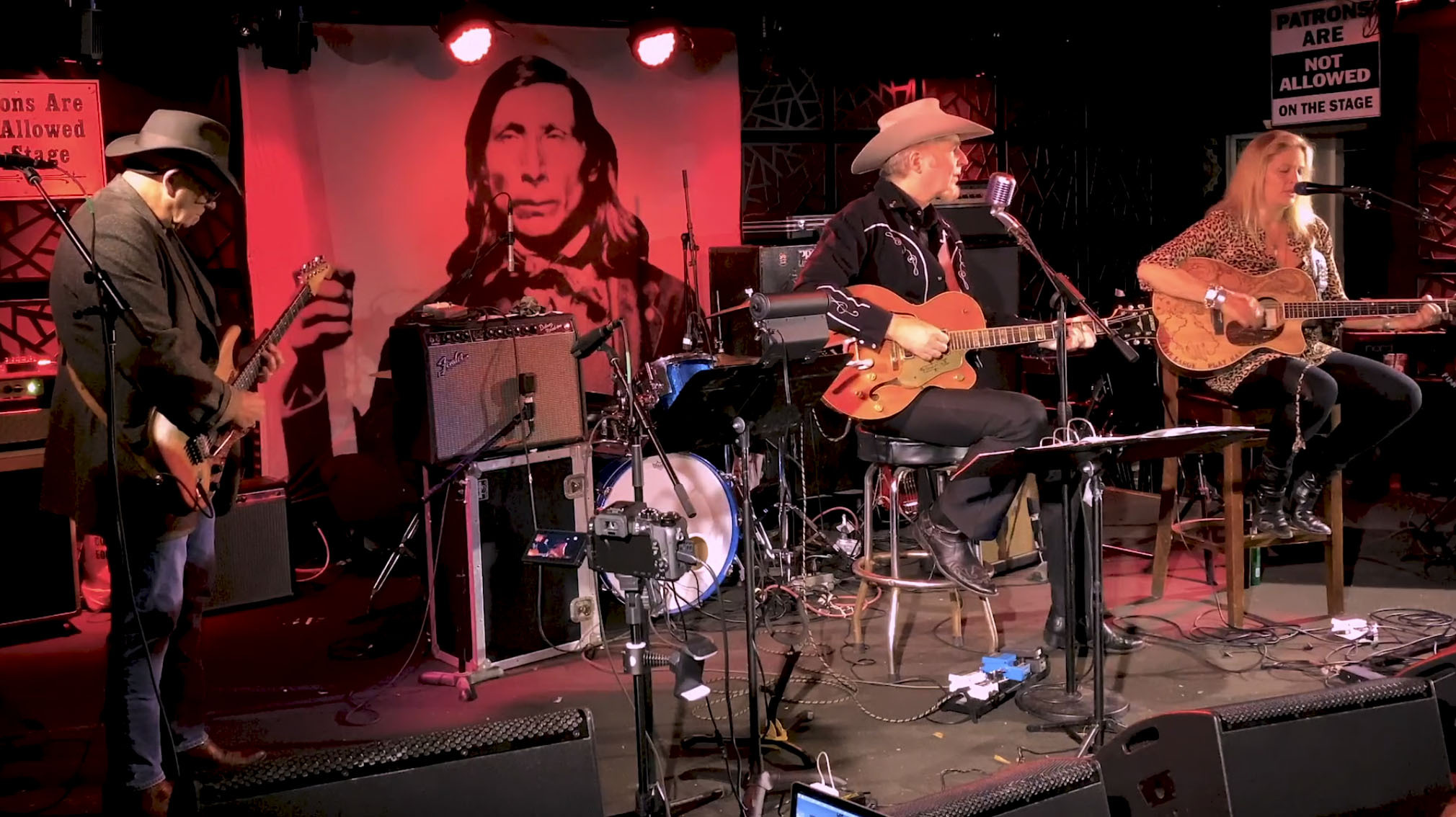 Gene Casey and Nancy Atlas performing on The Stephen Talkhouse stage in a still image from an upcoming episode of Friday Night Hustle.