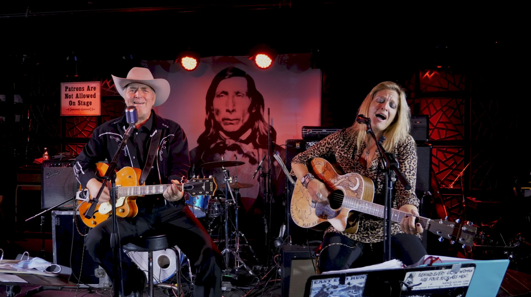 Gene Casey and Nancy Atlas performing on The Stephen Talkhouse stage in a still image from an upcoming episode of Friday Night Hustle.