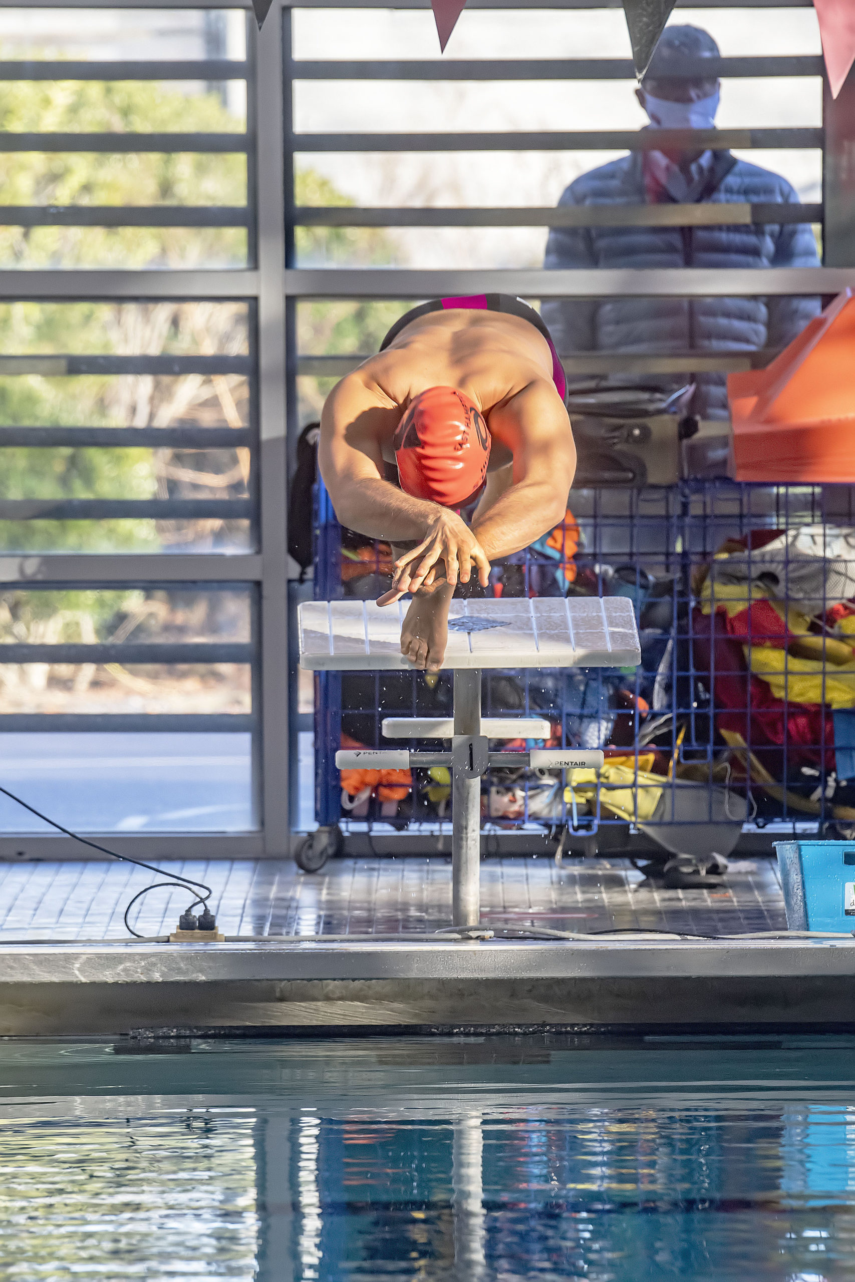 A Hurricane competitor dives as he starts a heat during the swim meet between the East Hampton Hurricanes travel team and the Bluefish from the Huntington YMCA at the East Hampton YMCA RECenter on Saturday afternoon.       MICHAEL HELLER