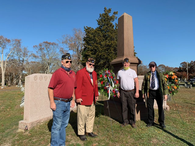 In observance of Veteran's Day, members of the Arthur Hamm Ellis American Legion Post #834 Westhampton  placed a wreath at the Westhampton Cemetery Veterans Memorial Stones on Sunday November 8. Left to right, Fred Bauer, Adjutant Paul Haines, Michael Berdinka, and Tom Mendenhall. 