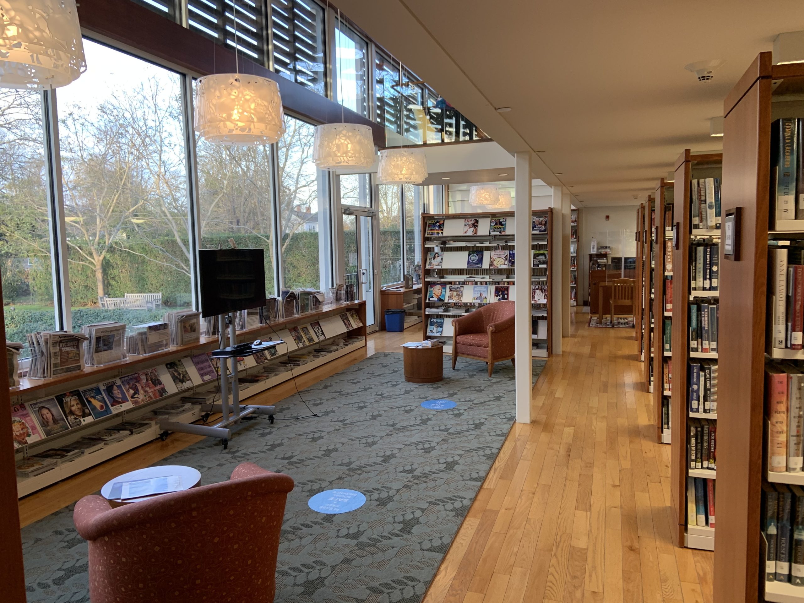 The reading area, with large windows overlooking the back lawn, will remain as is when the Hampton Library undertakes a renovation. STEPHEN J. KOTZ