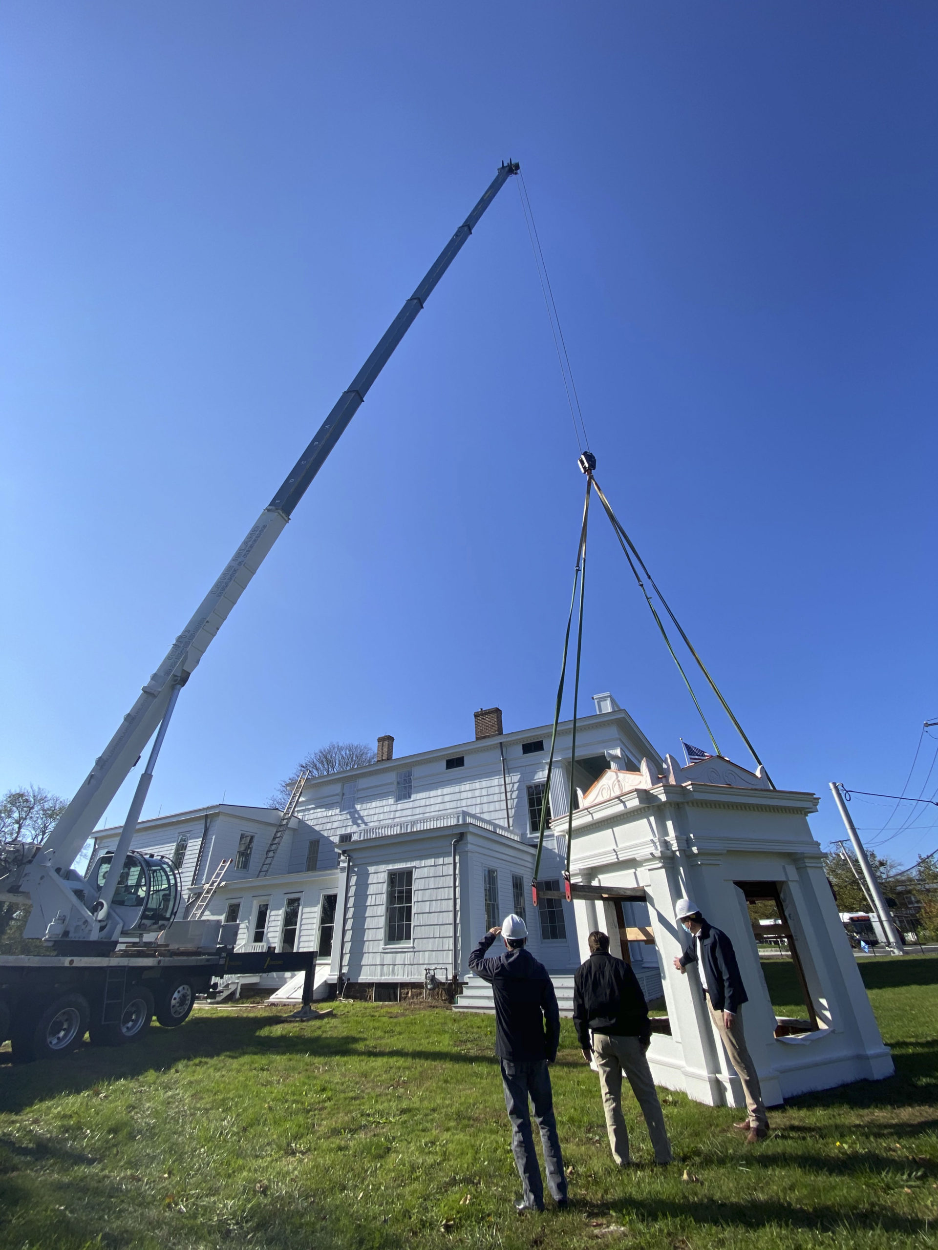 The decorative cupola was placed back on the rooftopof the National Rogers House in Bridgehampton. DANA SHAW
