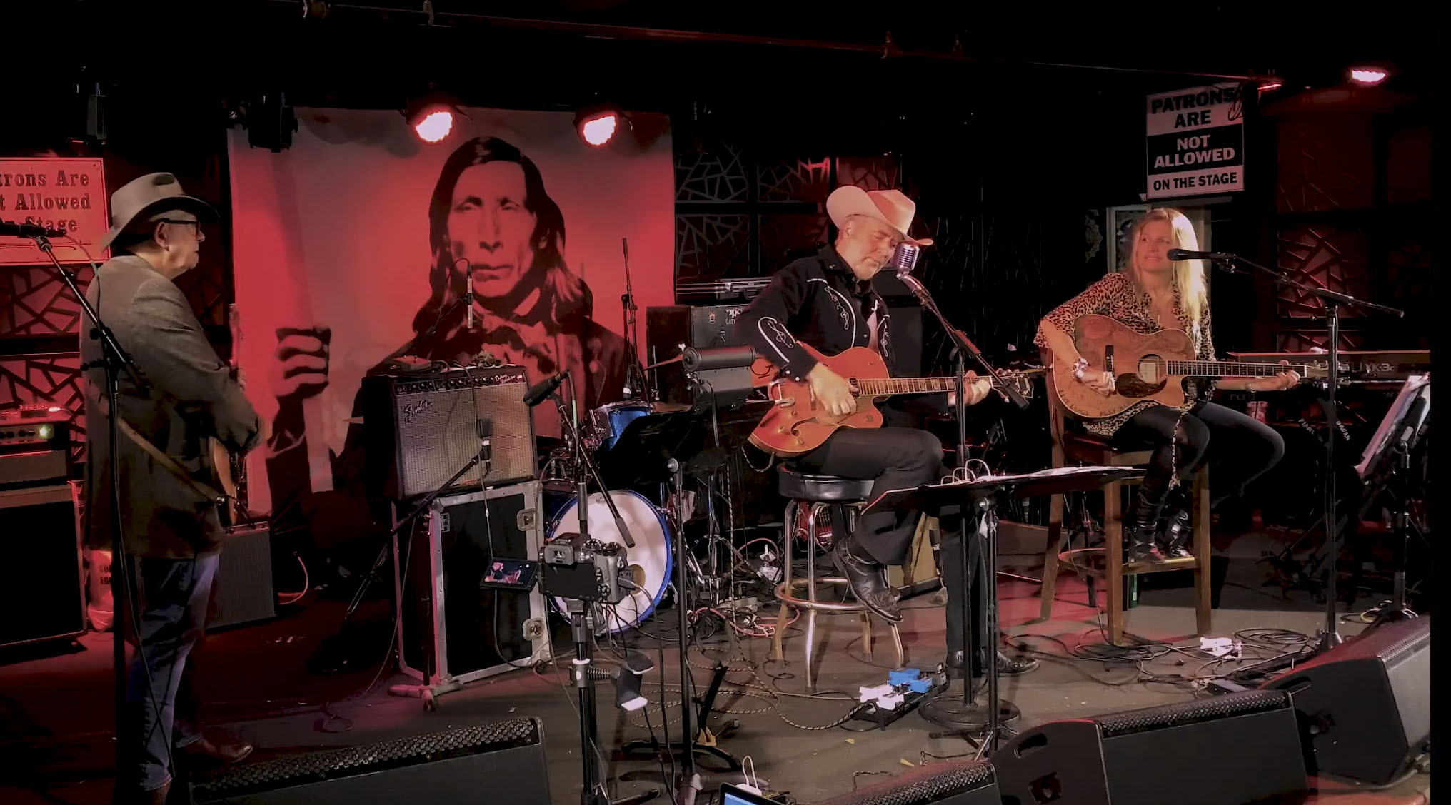 Gene Casey and Nancy Atlas performing on The Stephen Talkhouse stage in a still image from an upcoming episode of Friday Night Hustle.