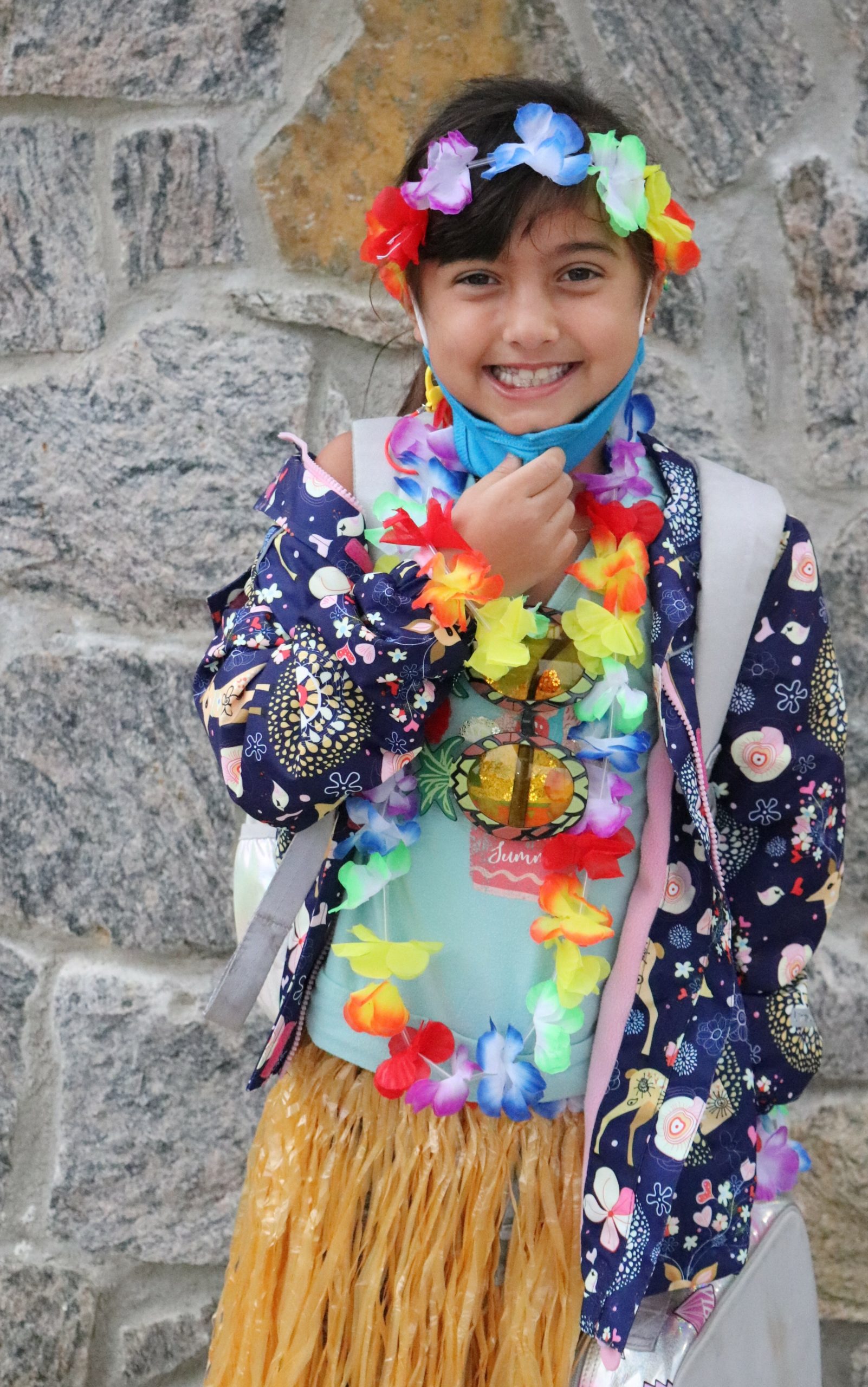 Second-grade student, Gianna Trimarco celebrates Hawaian Luau Day as part of Raynor Country Day School's Red Ribbon Week.