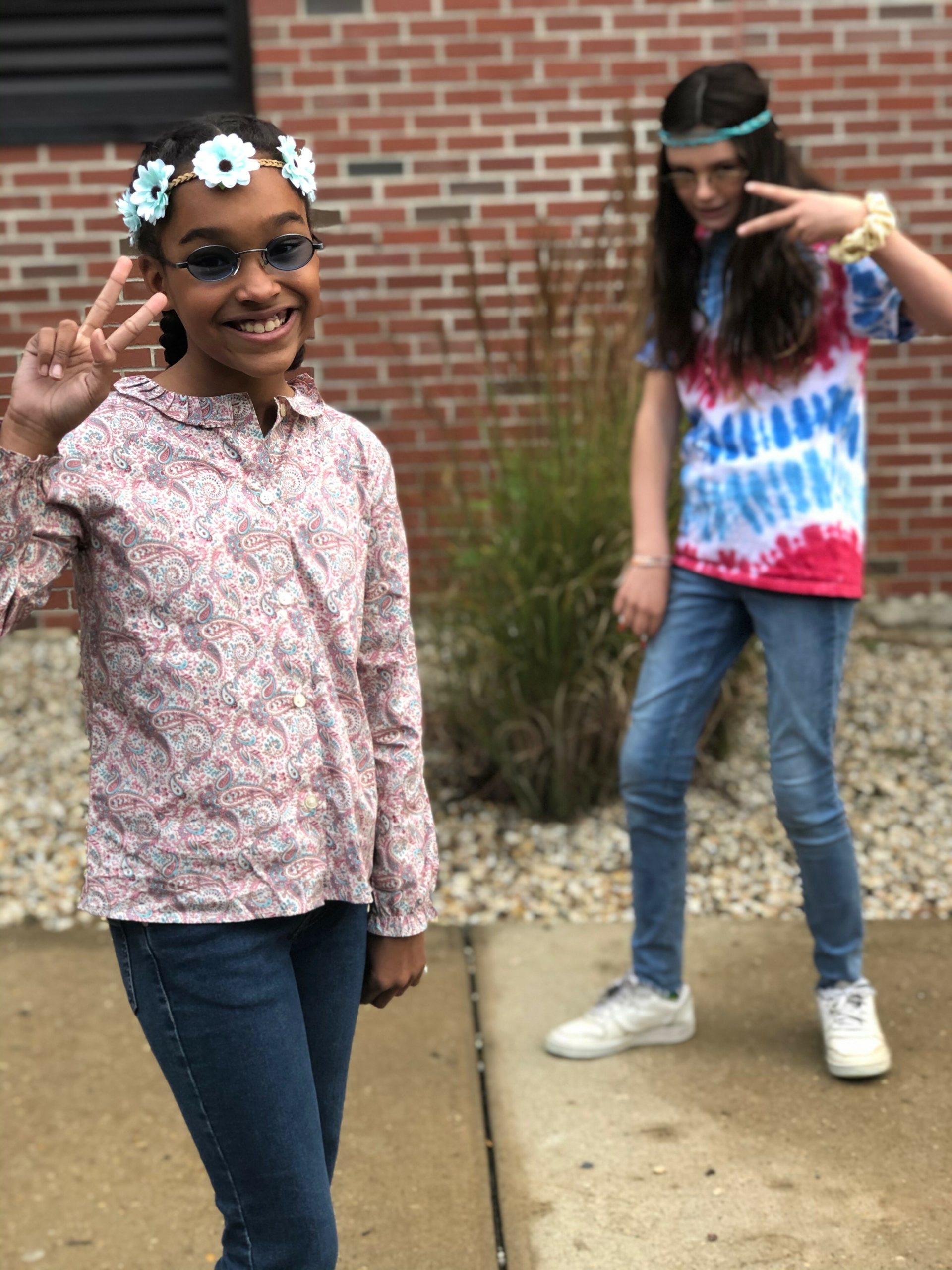 Sixth graders Paige Francis and Wiley Reuss dressed in outfits from their favorite decade on “Throwback Tuesday,” during Red Ribbon Week at Pierson Middle School.  