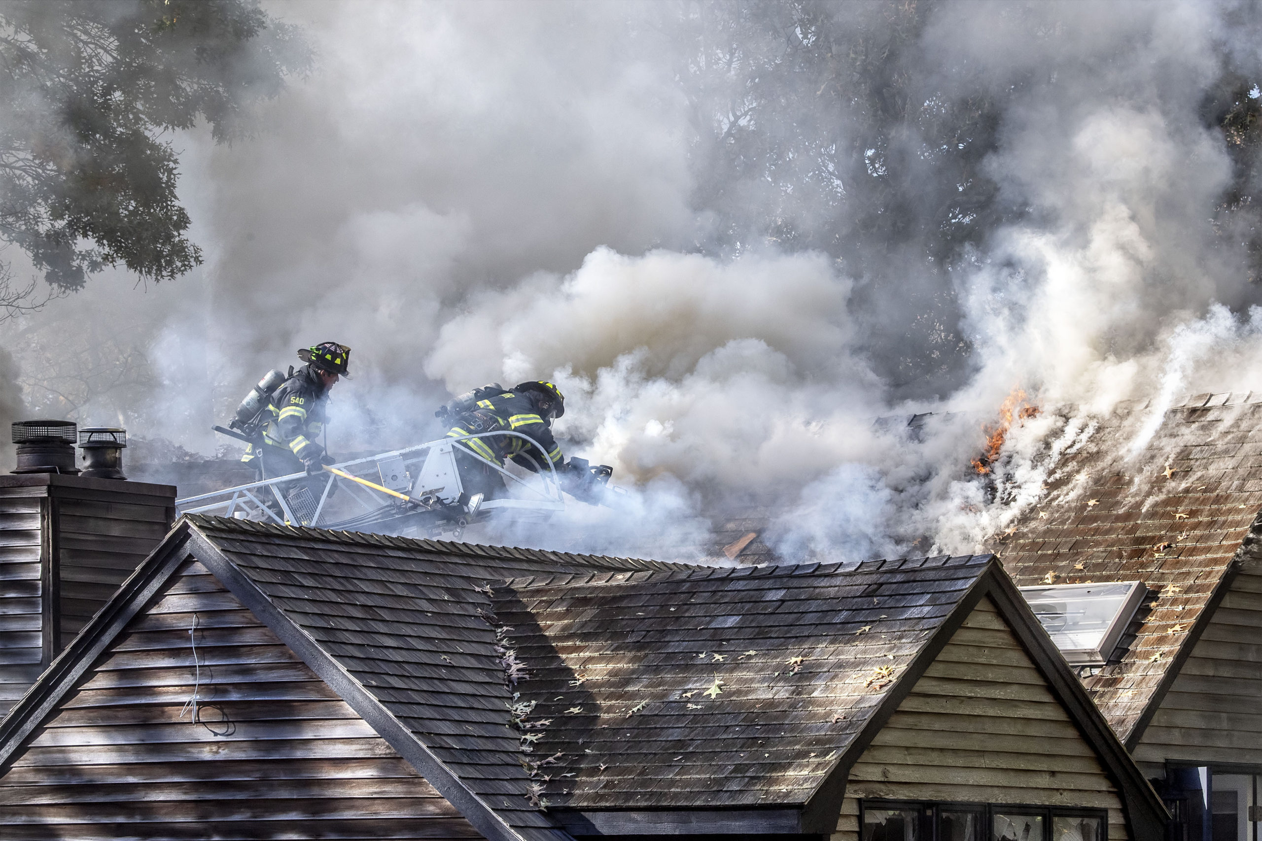 Sag Harbor Fire Department firefighters were assisted by firefighters from the East Hampton, Bridgehampton, North Sea and Southampton Fire Departments as they fought a stubborn blaze in a residence at 148 Harbor Watch Court on Saturday.   MICHAEL HELLER