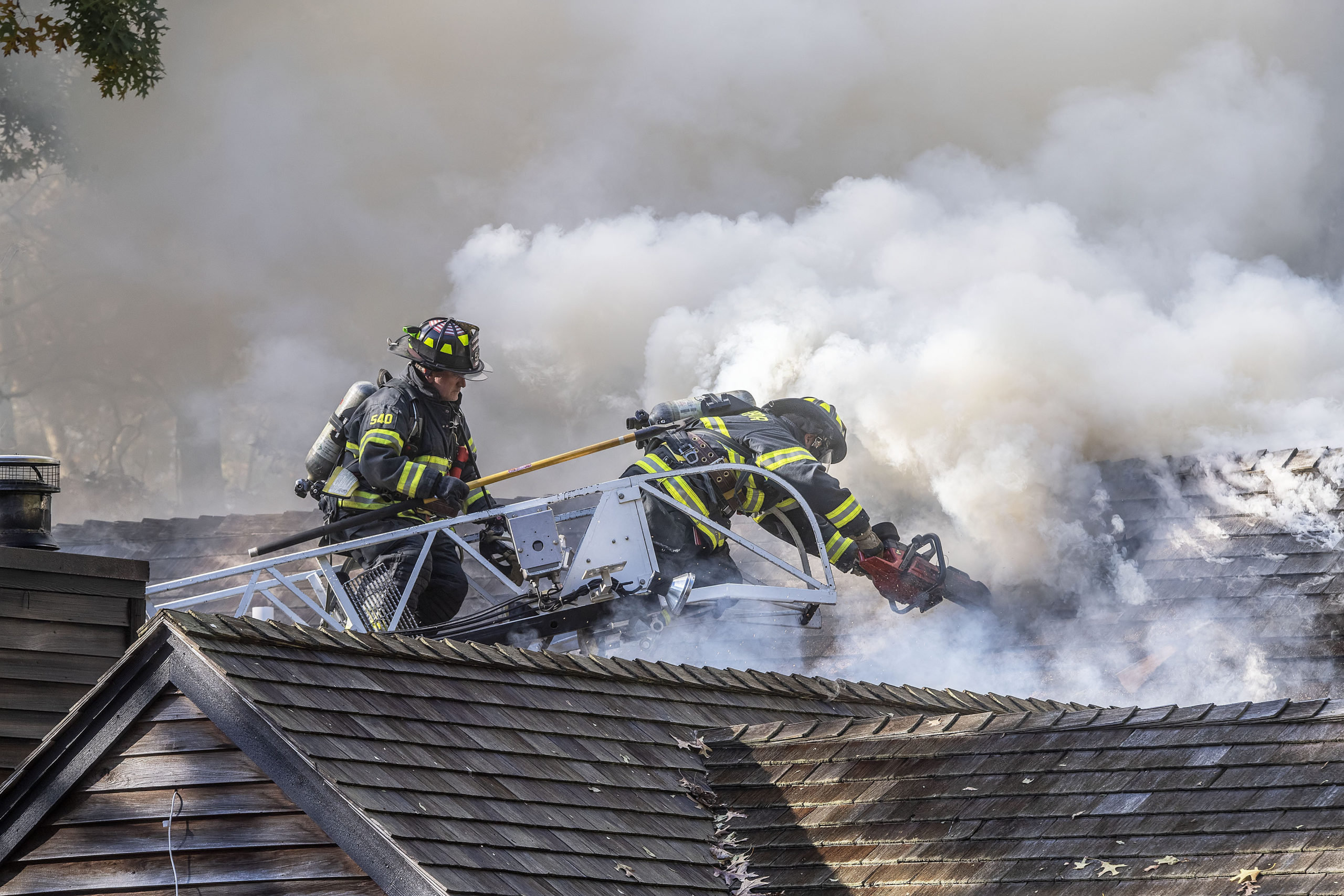 Sag Harbor Fire Department firefighters were assisted by firefighters from the East Hampton, Bridgehampton, North Sea and Southampton Fire Departments as they fought a stubborn blaze in a residence at 148 Harbor Watch Court on Saturday.    MICHAEL HELLER