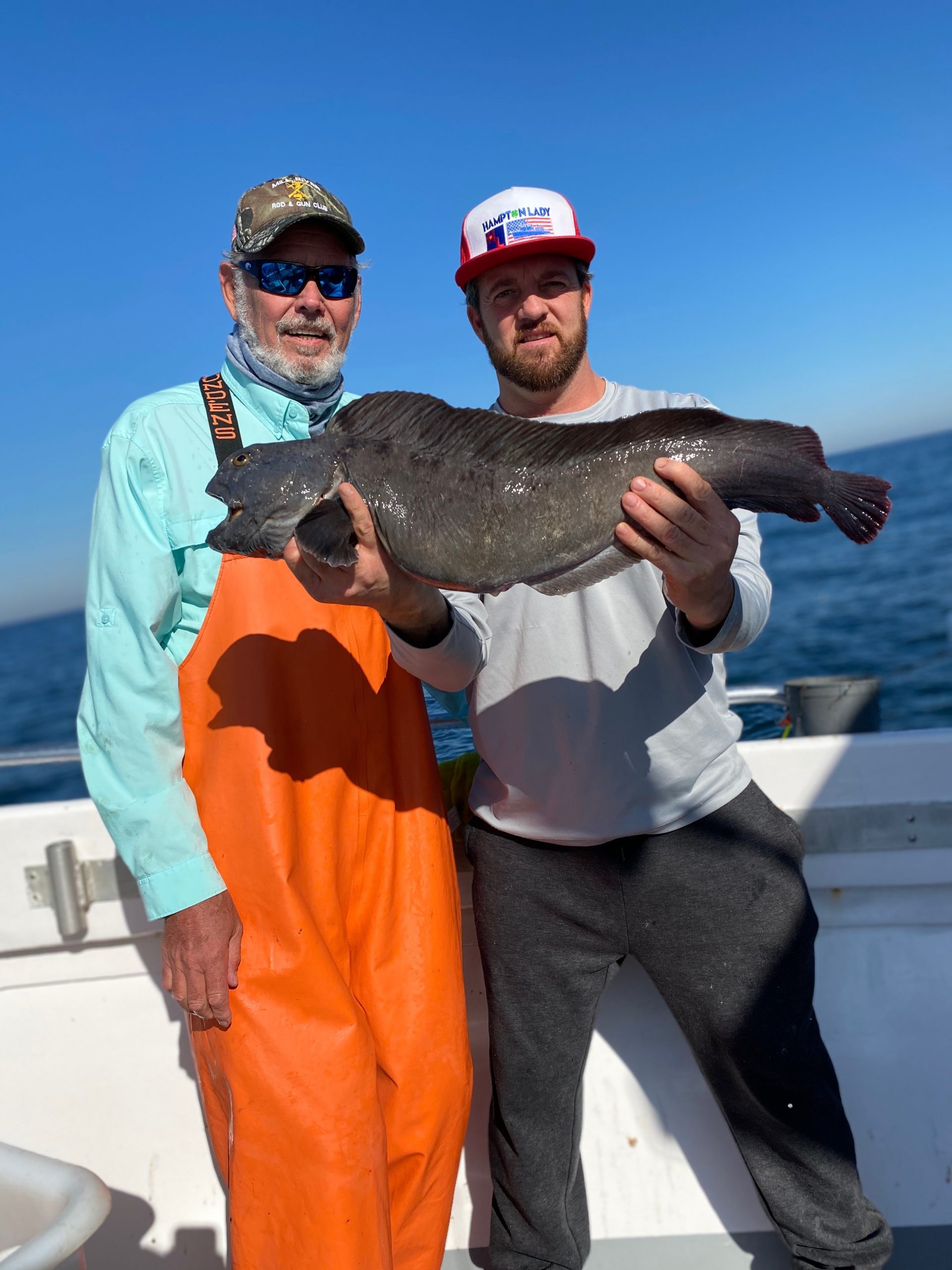 Kevin Walsh and Capt. James Foley show off a rare wolffish caught by Mr. Walsh while fishing for black sea bass aboard the Hampton Lady last weekend. 
