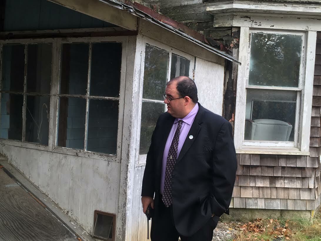 Southampton Town Public Safety Administrator Ryan Murphy made note of multiple access points for animals in the Eastport zombie house. KITTY MERRILL