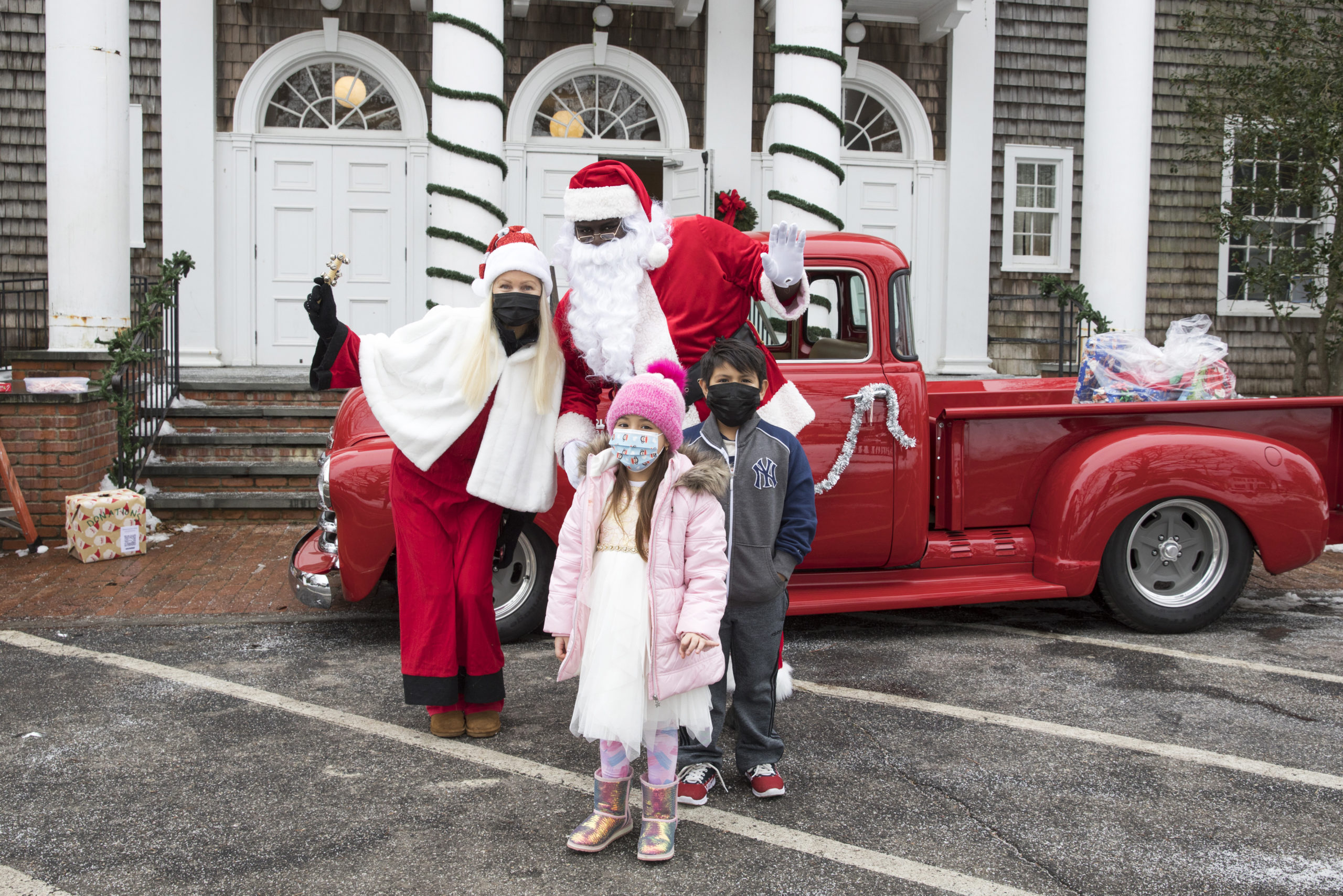 Hampton’s Community Outreach Organization holds a toy drive at the Bridgehampton Community Center on Sunday, December 21, with Sofia Lopez 6, and Justin Lopez, 7, stopping by to meet Santa. 