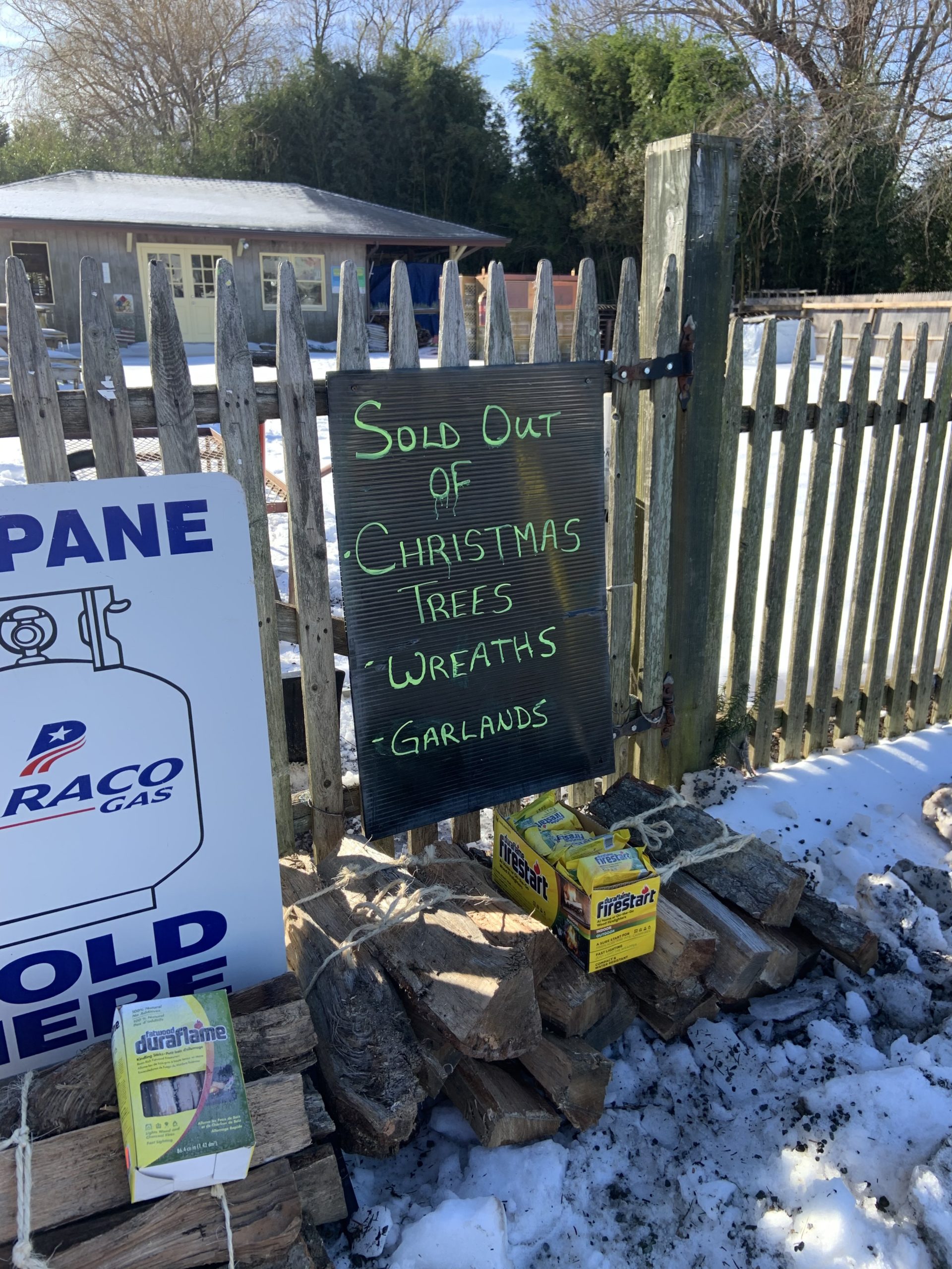 The sign at the Sag Harbor Garden Center says it all. High demand and reduced supplies have combined to make Christmas trees a scarce commodity for those who waited. STEPHEN J. KOTZ