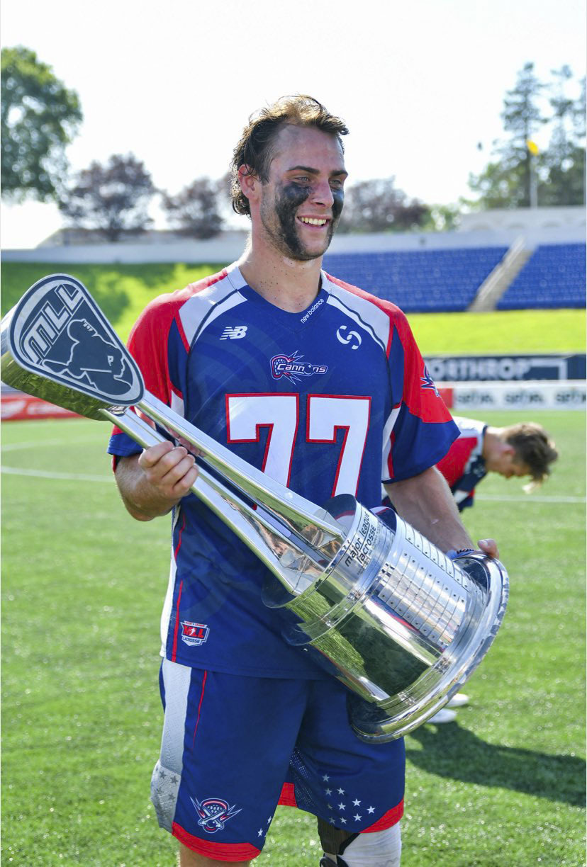 Boston Cannons defender Justin Pugal, an Eastport-South Manor graduate and Stony Brook University alumnus, with the 2019 Major League Lacrosse championship trophy.   COURTESY JUSTING PUGAL