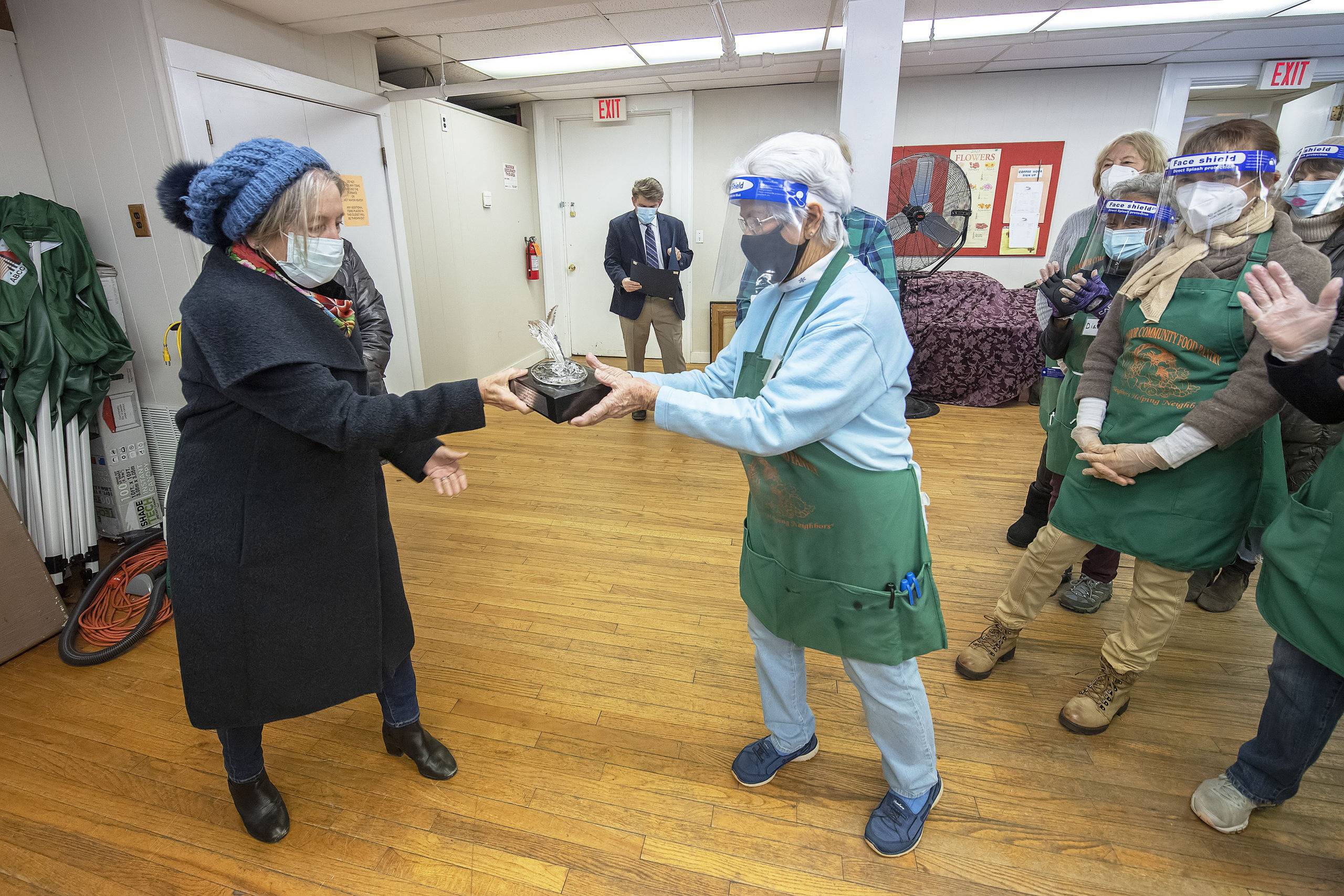 Susan Mead, of the Sag Harbor Partnership, presents Evie Ramunno with the nonprofit's Community Service Award. 