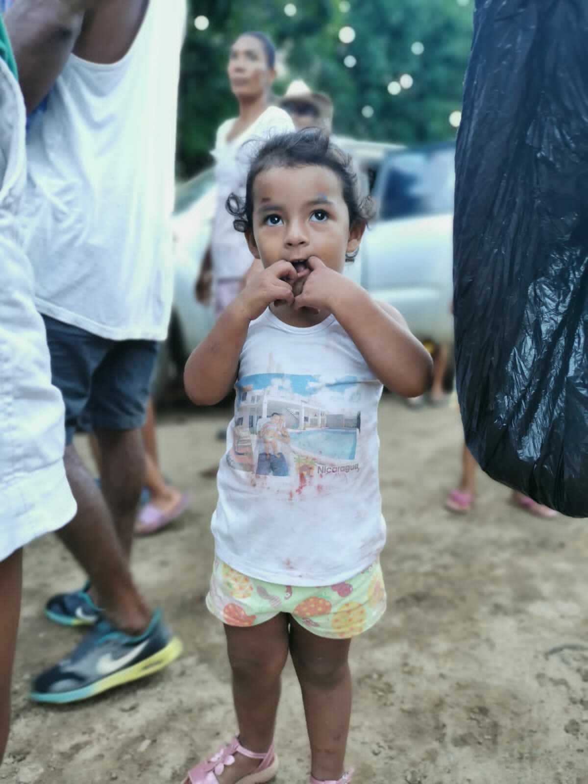 Volunteers from different communities help divide and repackage donations before distributing them to neighborhoods destroyed by hurricane flooding and high winds in Nicaragua.