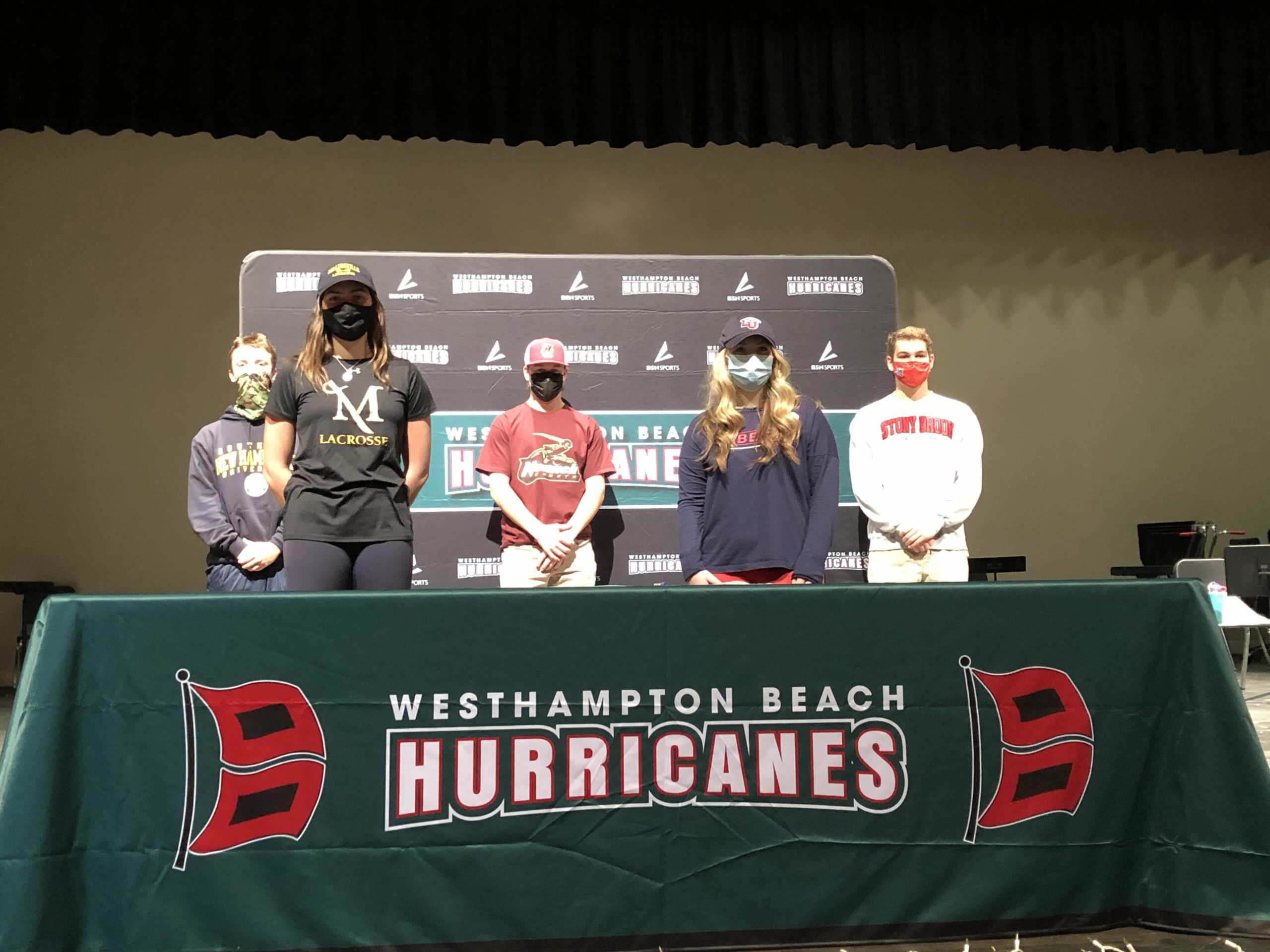 Sporting college apparel, eight Westhampton Beach High School senior athletes signed national letters of intent during an informal ceremony in the district’s athletic office during the week of November 30. The students were: Maureen Duffy, lacrosse, University of Virginia; Brandon Erbis, baseball, Southern New Hampshire University; Casey Gallagher, lacrosse, La Salle University; Taylor Gallerello, lacrosse, Liberty University; Campbell Kast, lacrosse, Millersville University; Ryan Miller, baseball, Norwich University; Robert Moore, lacrosse, Fairfield University; and Peter Trainor, lacrosse, Stony Brook University.