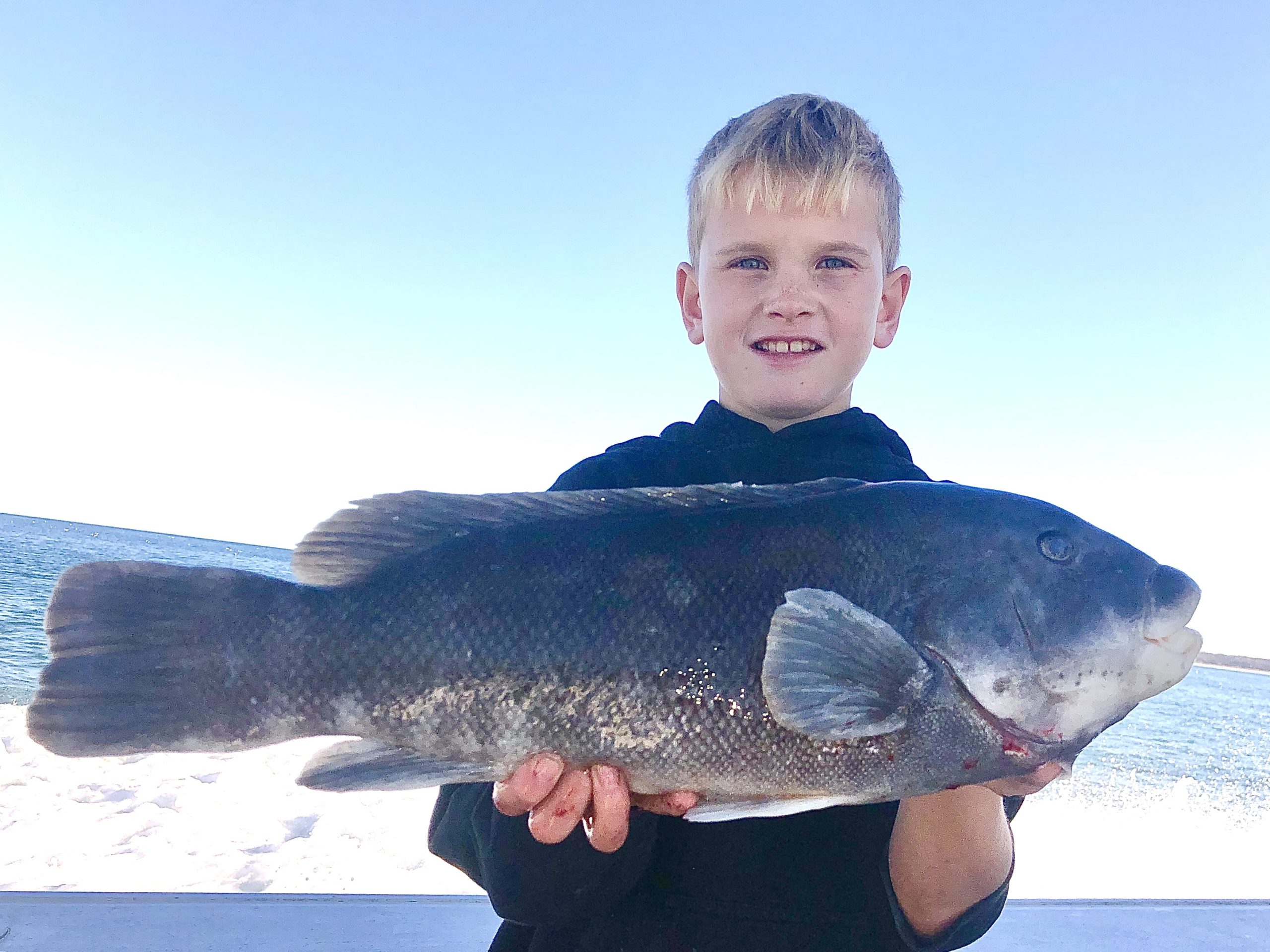 Matty Dettleff with a big Fishers Island blackfish caught aboard the Flying Dutchman.
