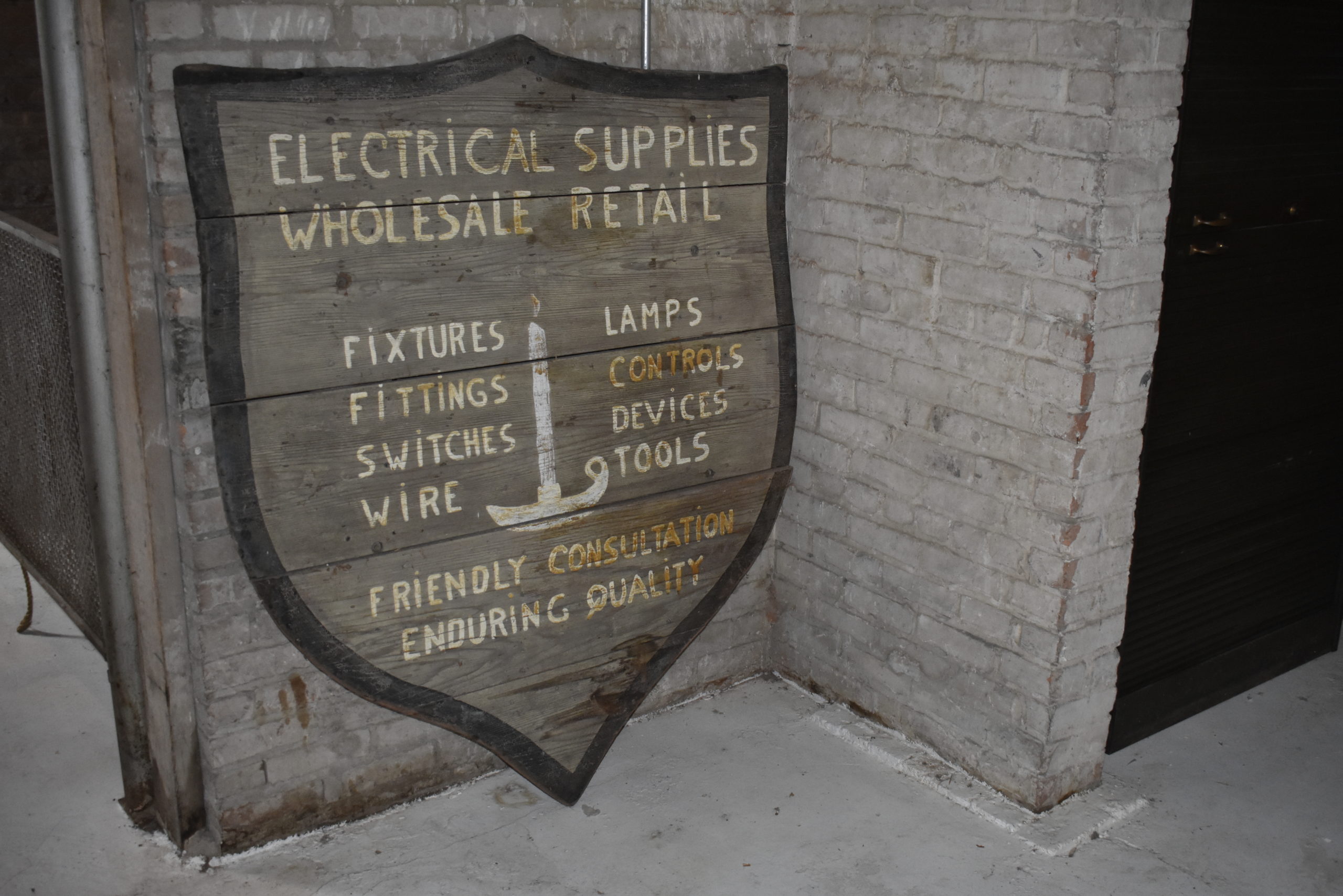 An old sign from the building's days as an electrical supply house.